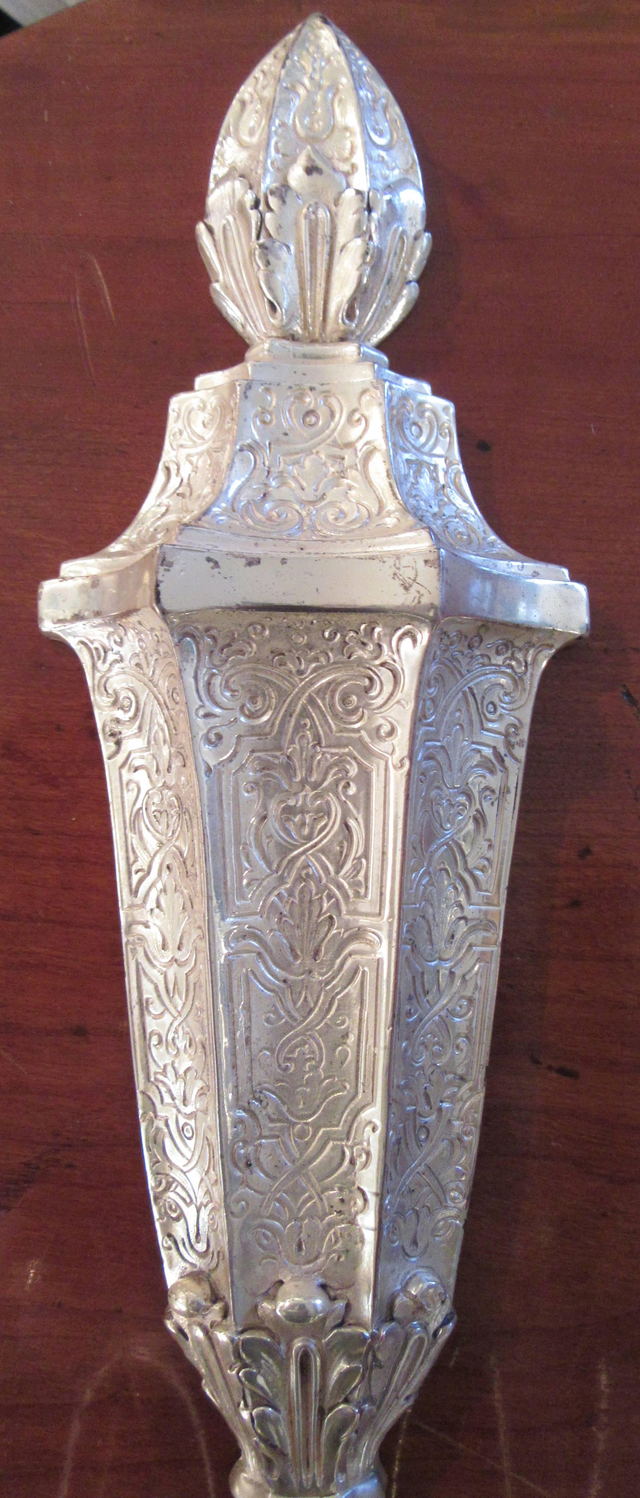 A pair of turn of the century silver plate etched two-arm wall sconces with tassel bottom and finial top.