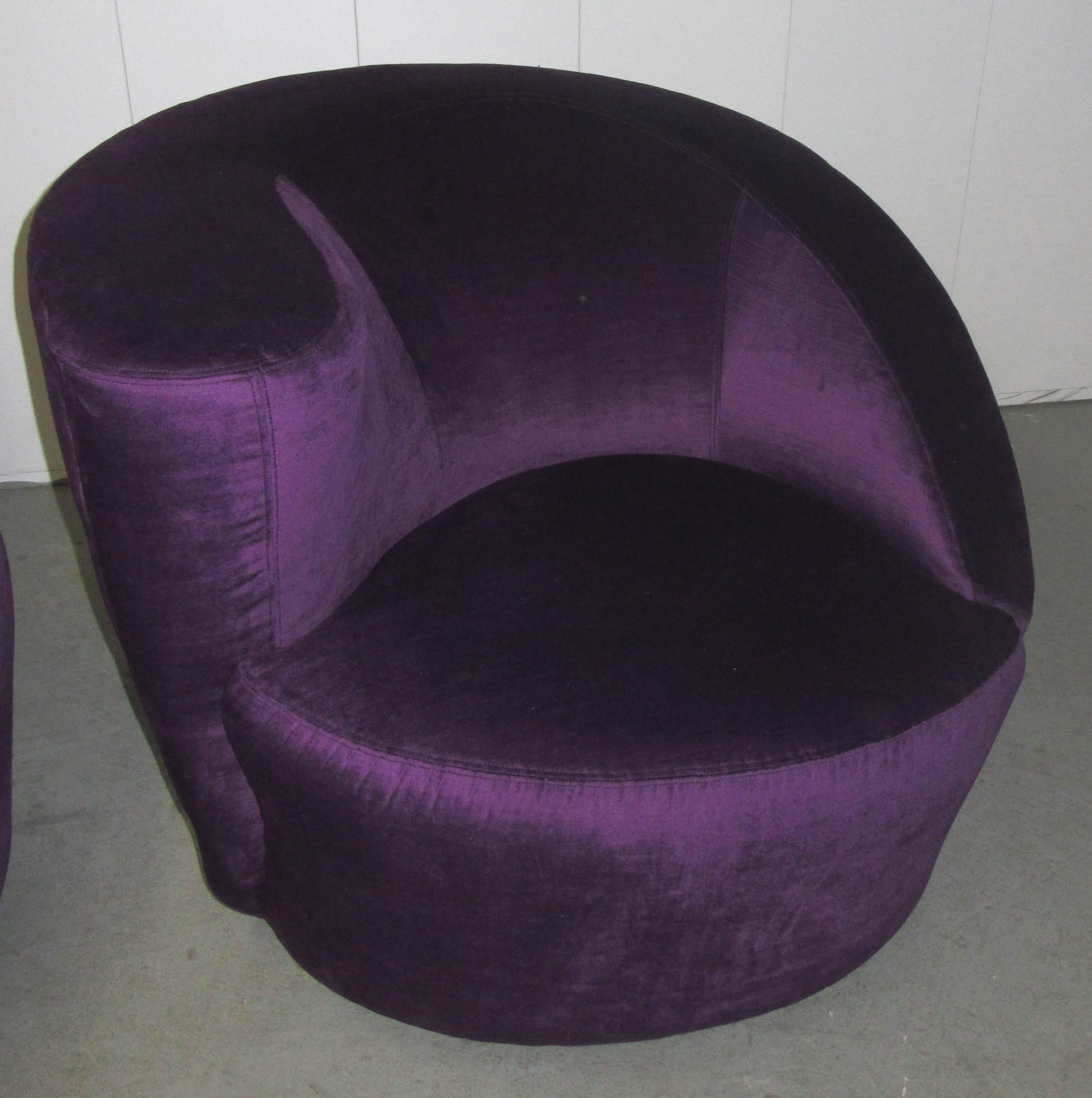 Newly upholstered in a luxurious velvet, the nautilus chair represents Kagan's innovative use of sculpture and asymmetry in contemporary furniture design. The comfortable padded chair sits on a round platform base and uses a memory swivel.