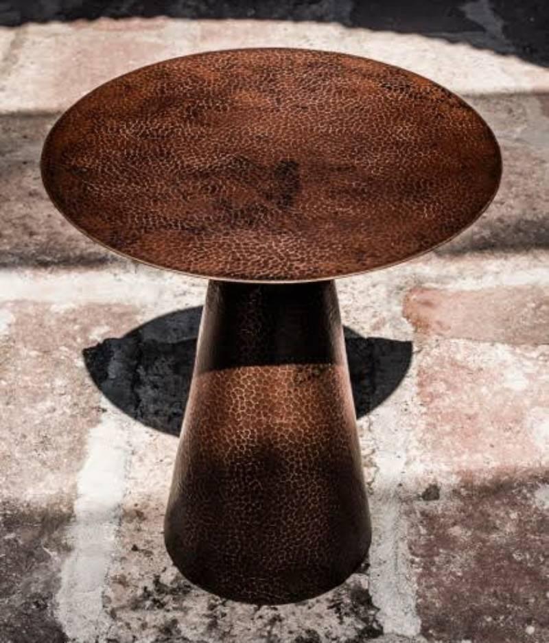 Designed by Miguel Angel Arregui and crafted by Mexican artisans this table is created from a single sheet of copper. Two are available.