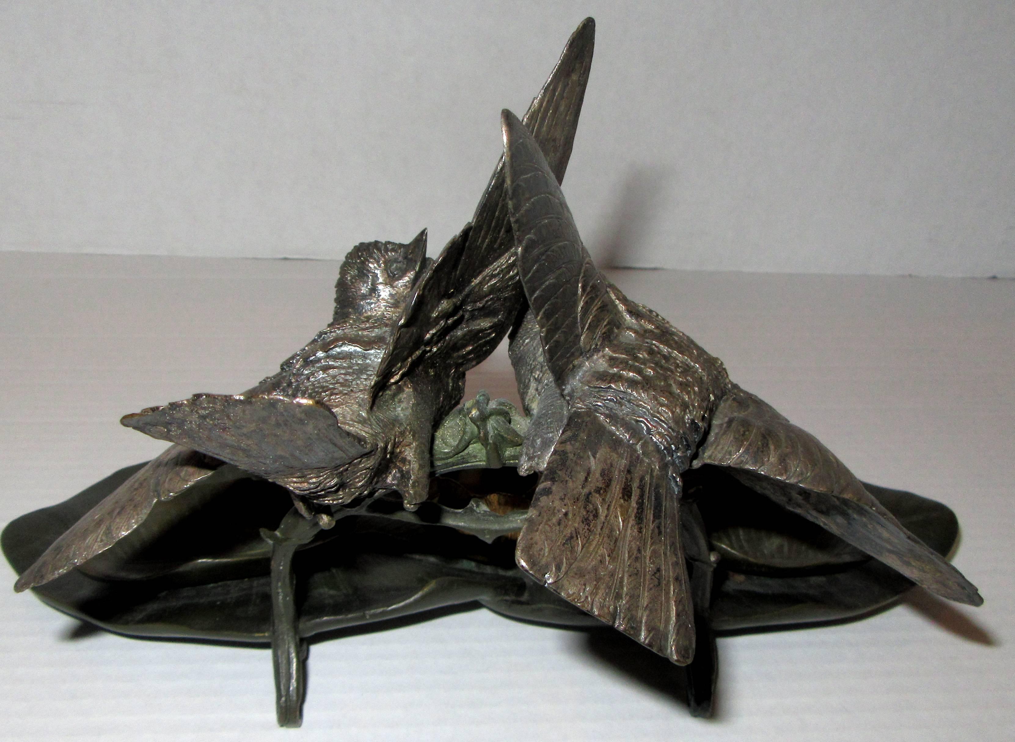 A detailed French Realism period nature themed bronze inkwell / pen tray. Leaves form the base while a pair of birds on branches hover above.