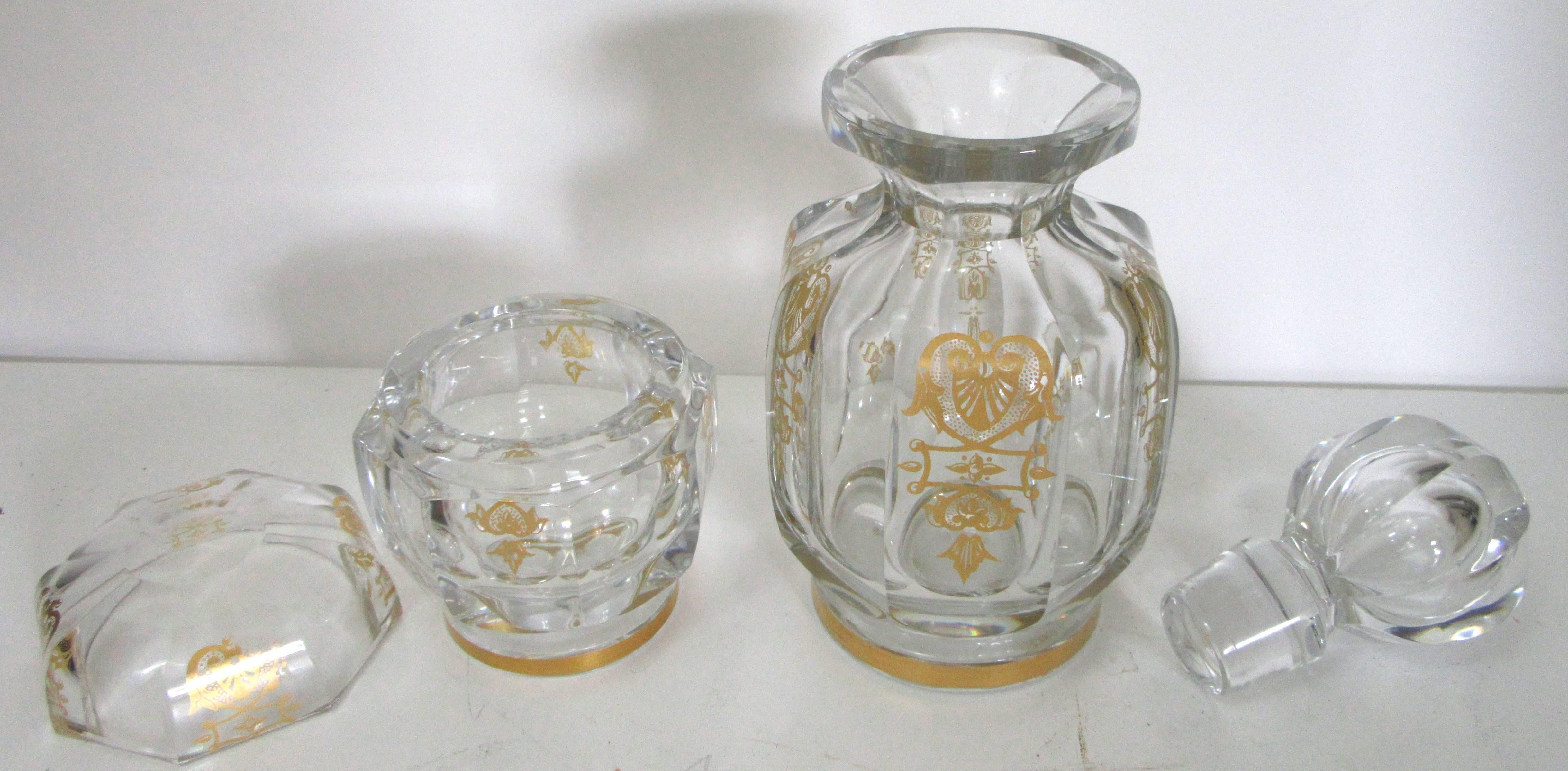 A French Second Empire period crystal decanter and a crystal lidded jar from Baccarat Paris embossed in gold with the 