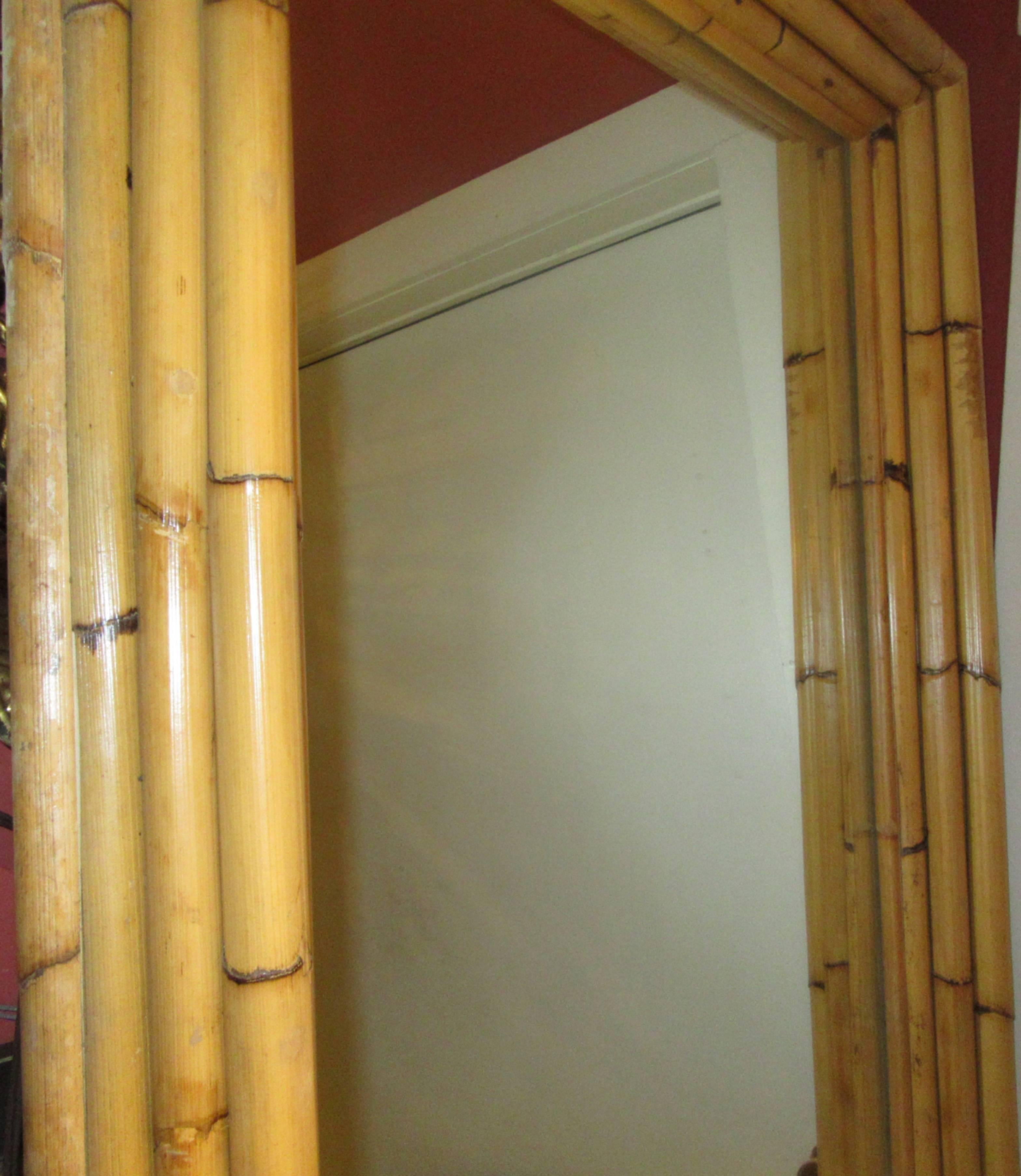 Natural bamboo pole frame wall mirror.