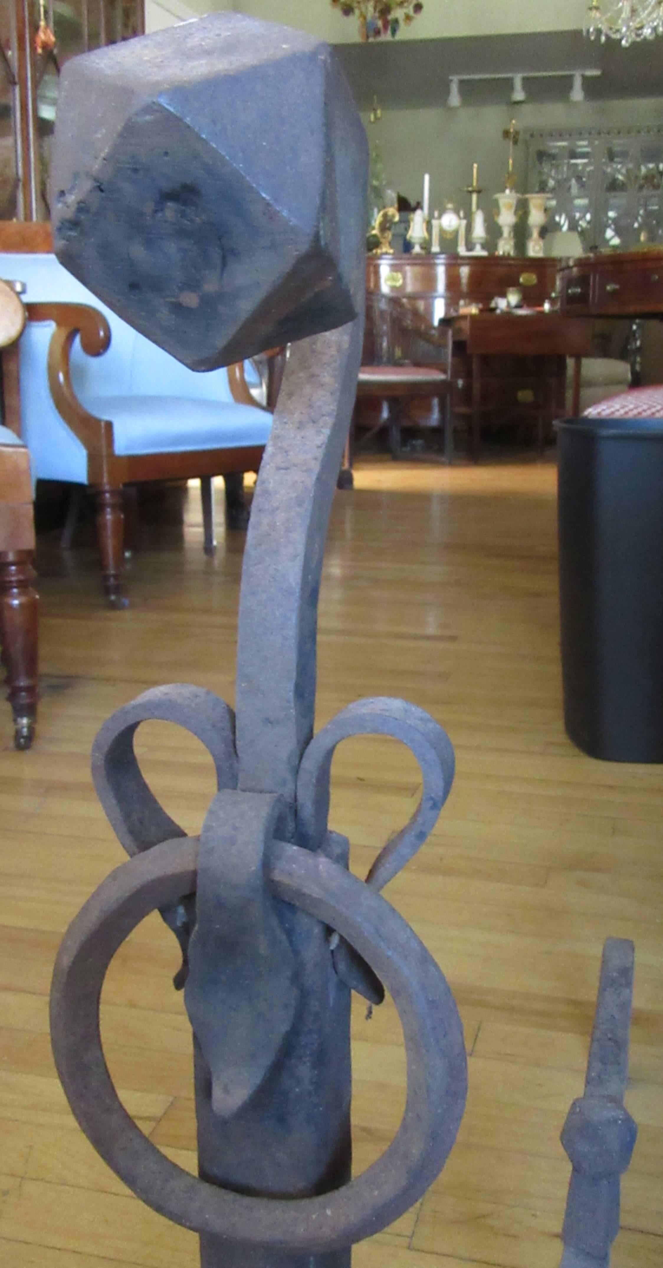 Large hand-forged iron fir place andirons with ball finials and decorative rings.