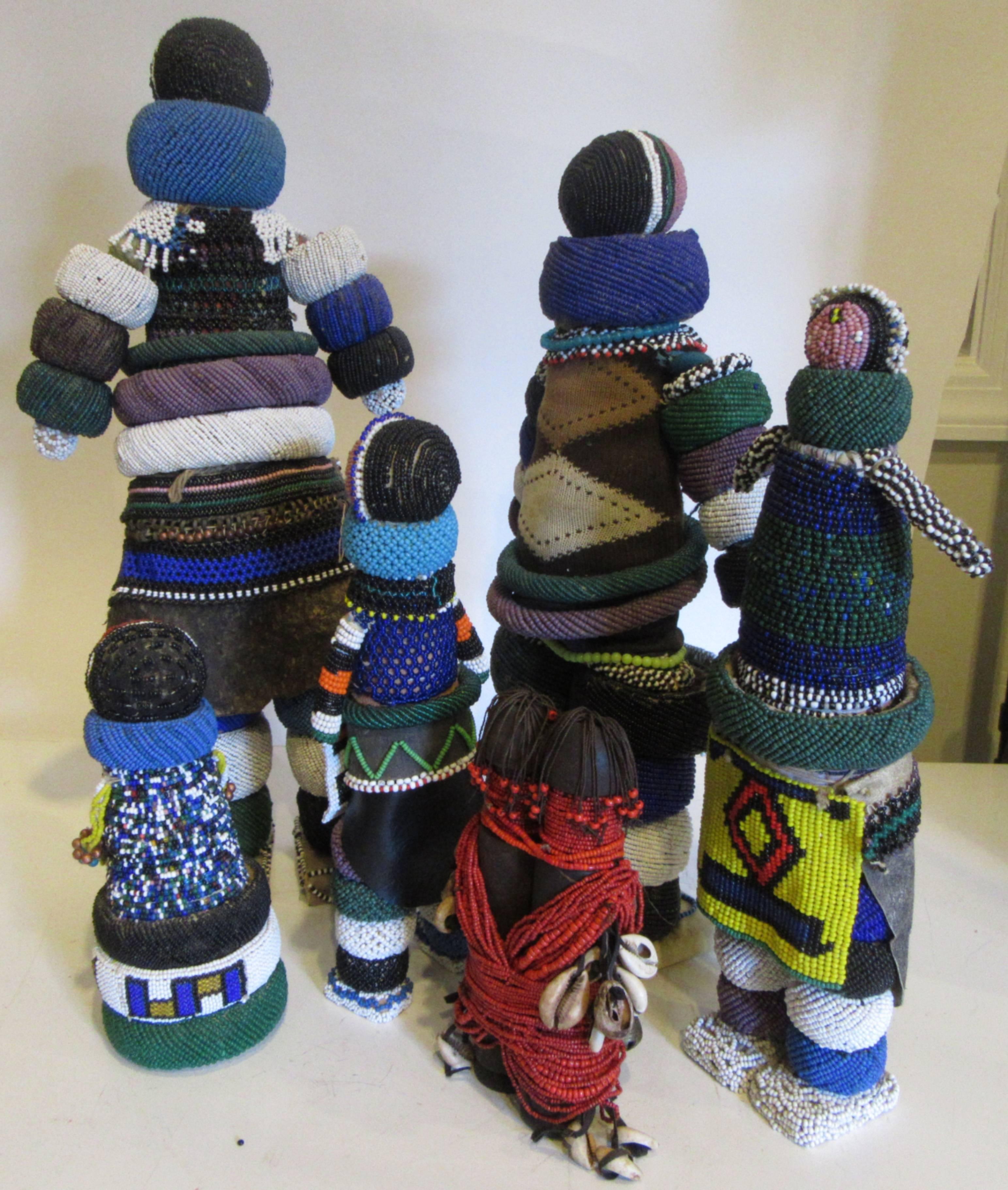 A group of six collected Ndebele hand beaded fertility dolls of various sizes and designs. The dolls are made in secret by the maternal grandmother of the bride and ritually presented when she moves into her new home.