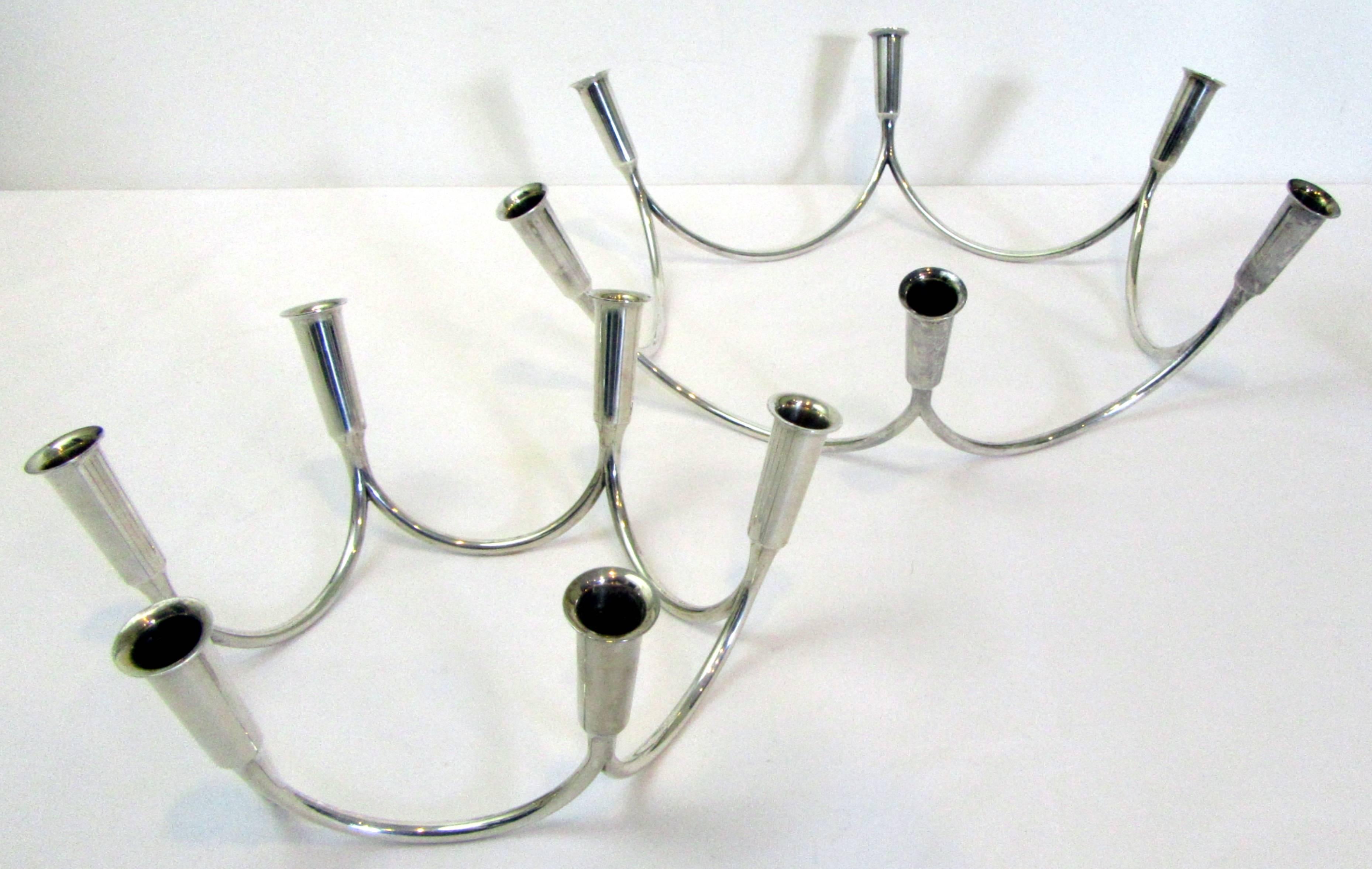A beautiful set of tapered silver crown-shaped Danish candelabra in two sizes.