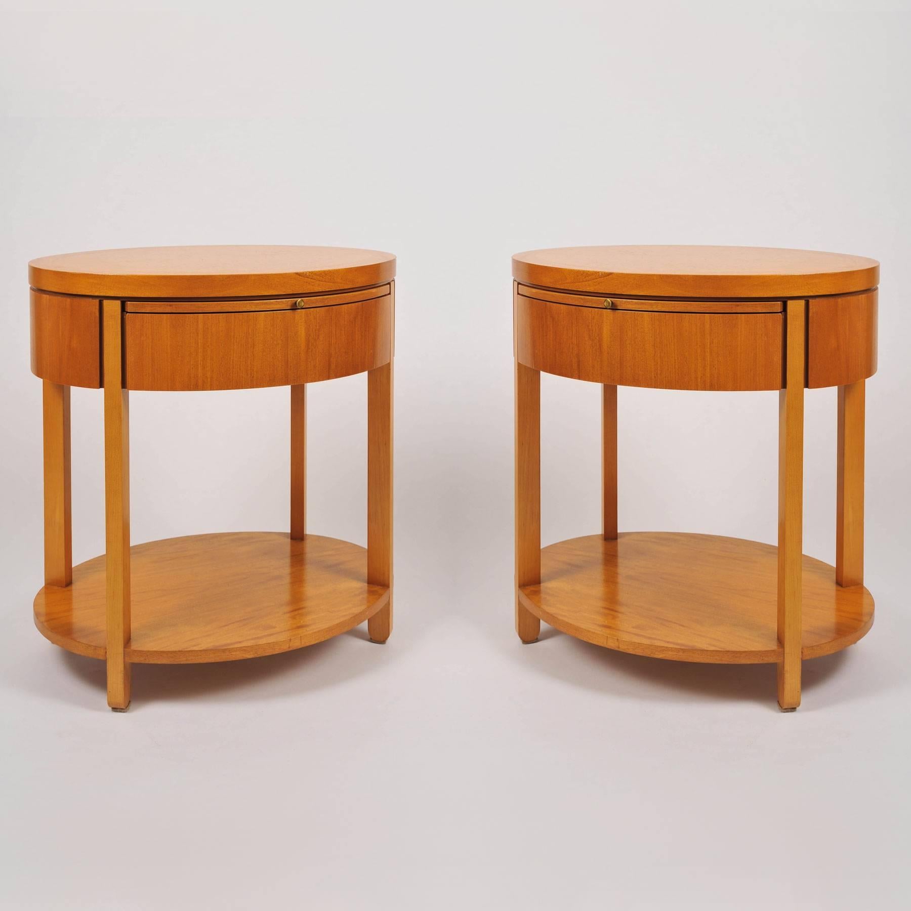 Pair of beautifully-grained primavera mahogany oval night stands each with a pull-out shelf, drawer and base shelf. Designed by Charles Pfister for Baker Furniture.
In 1989 The New York Times reviewed Pfister's collection as follows:
