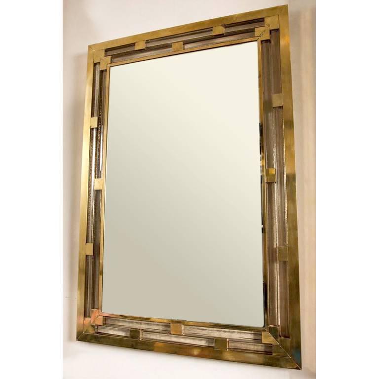 Contemporary Italian rectangular Mirror in a mid-century Italian style with a triple brass frame interspersed with Murano glass components of gentle 'champagne' hue.
Can be hung vertically or horizontally.