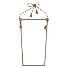 Mid-century Italian brass bow mirror