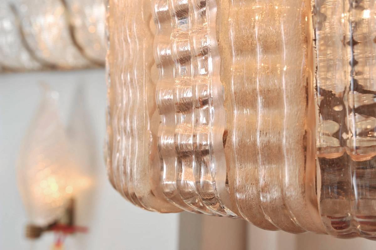 Glamorous large Italian chandelier, slightly tapering in towards the bottom, with 25 alternating textured glass panels in pale pink and frosted clear glass creating a wonderful light effect.
