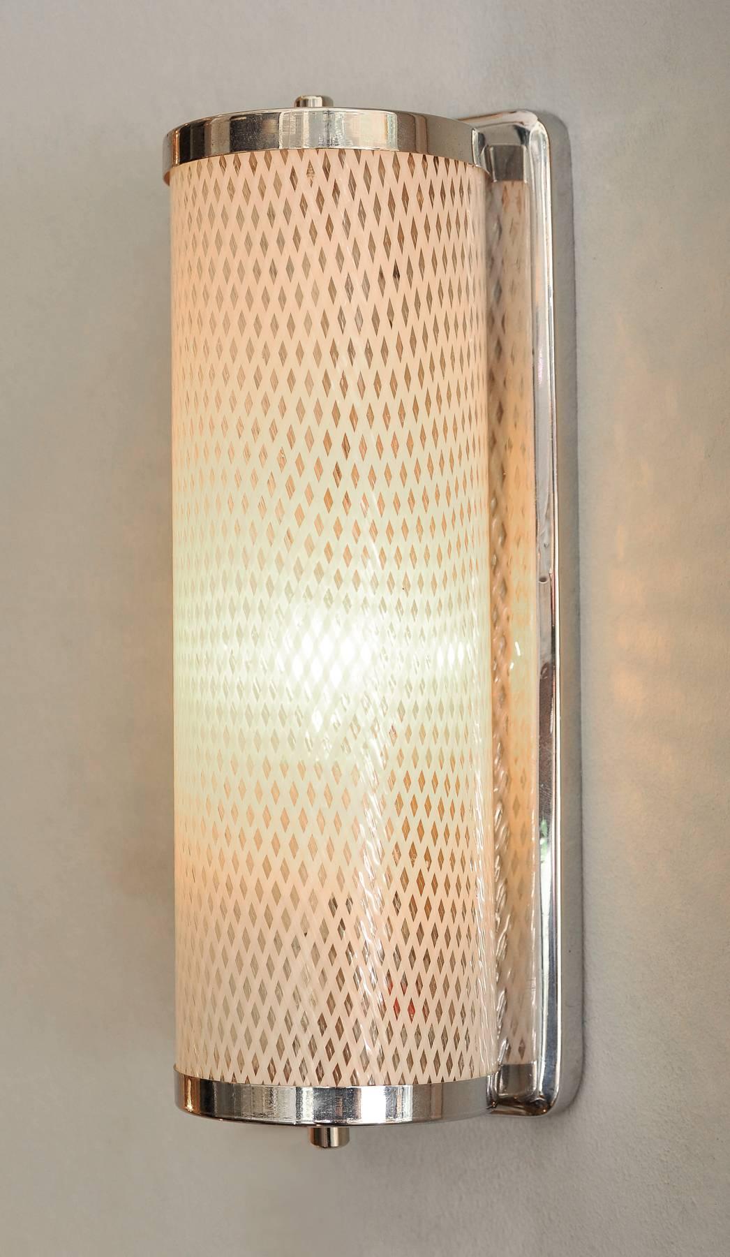 Italian wall lights? with chrome brackets holding vertical Murano glass shades with 'lattice' design.