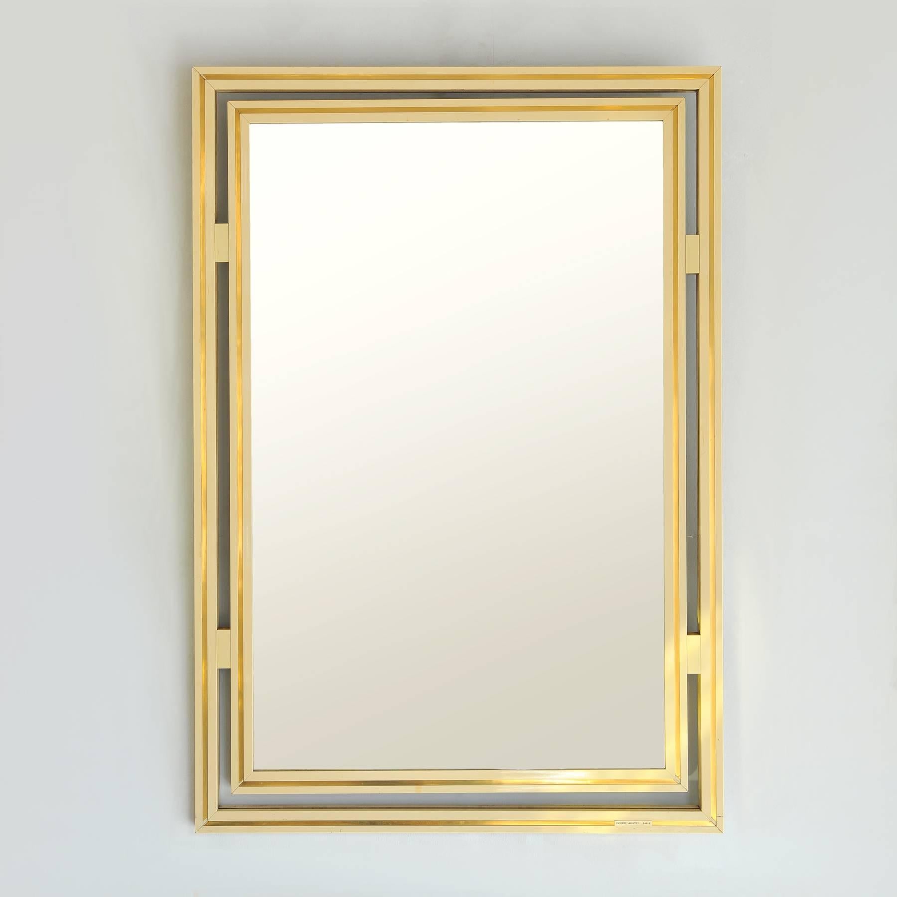 Stylish rectangular mirror with double striped frame in cream and 'gold', signed: 'Pierre Vandel, Paris'.