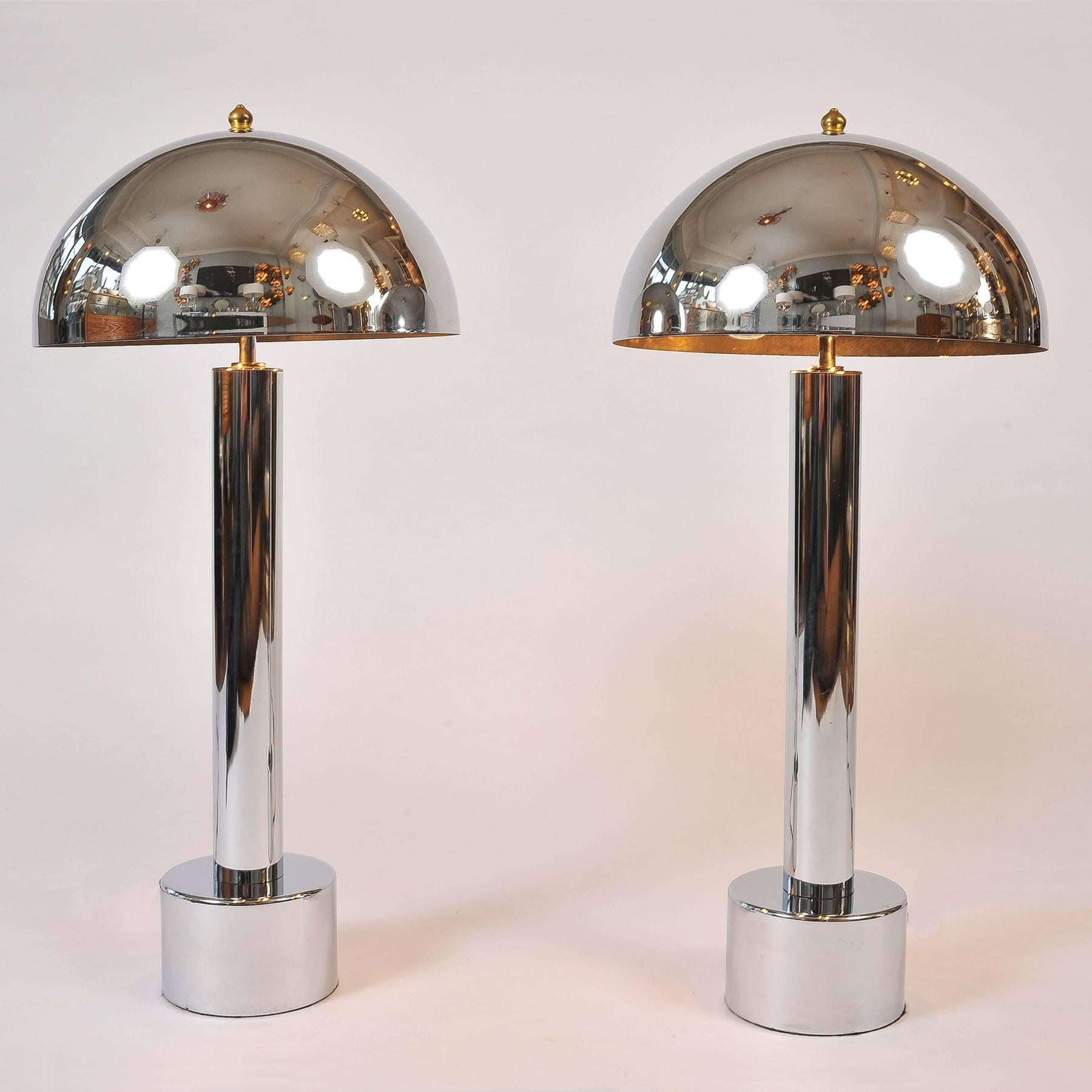 Tall chrome column table lamps with deep-tiered chrome base and chrome dome mushroom shades.