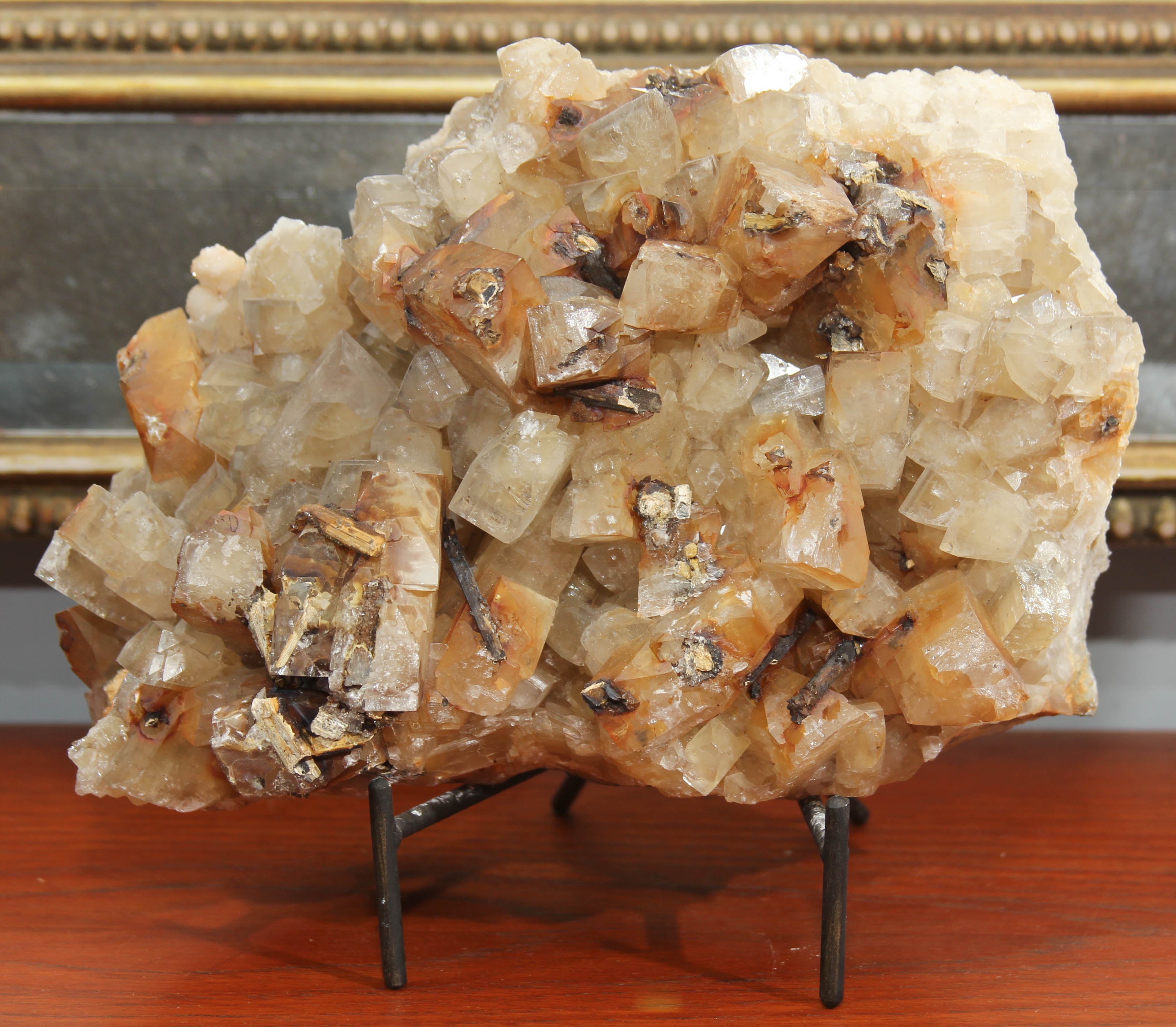 Handsome natural crystal specimen with stand. This can sit flat or sit within the stand. Perfect on a shelf or tabletop.