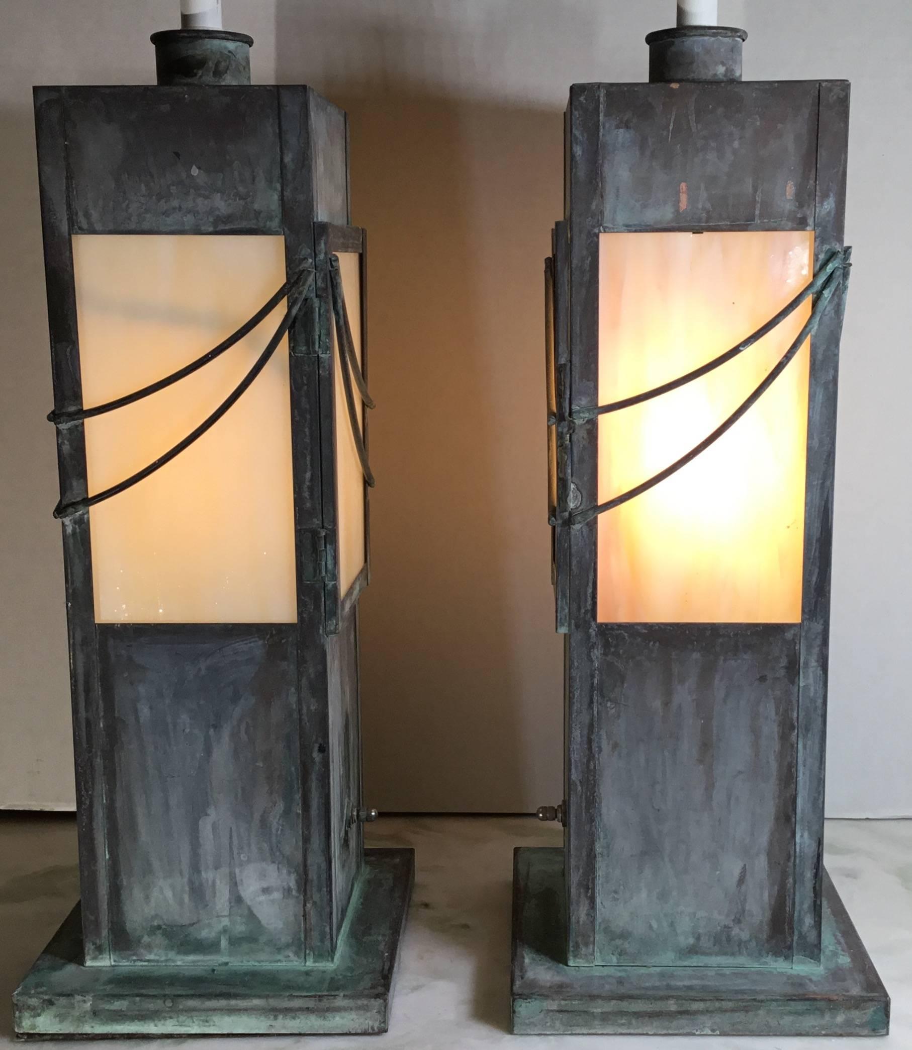 Pair of midcentury copper table lamps, artistically made of copper and decorative glass. With extra
Inside socket of 40/ watt and 60 /watt light on the top.