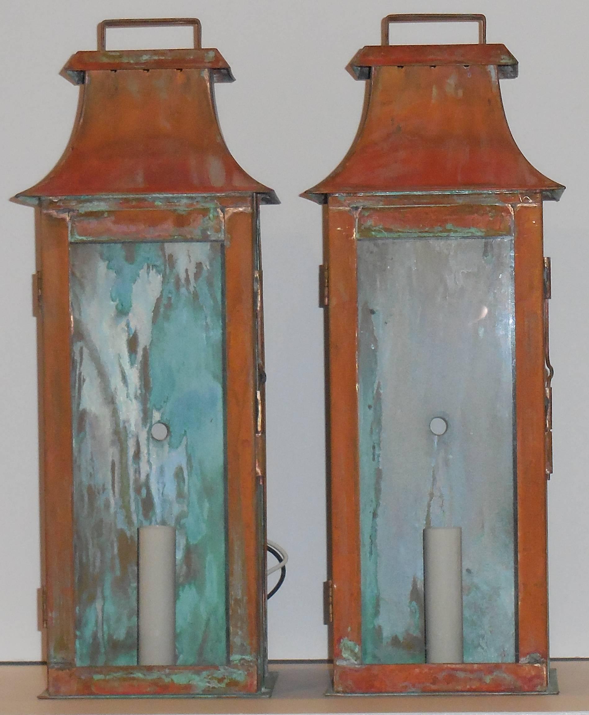 Beautiful pair of wall lanterns made of copper with one 60/watt light.
Great patina electrified and ready to light.
Made in the USA up to code UL approved.