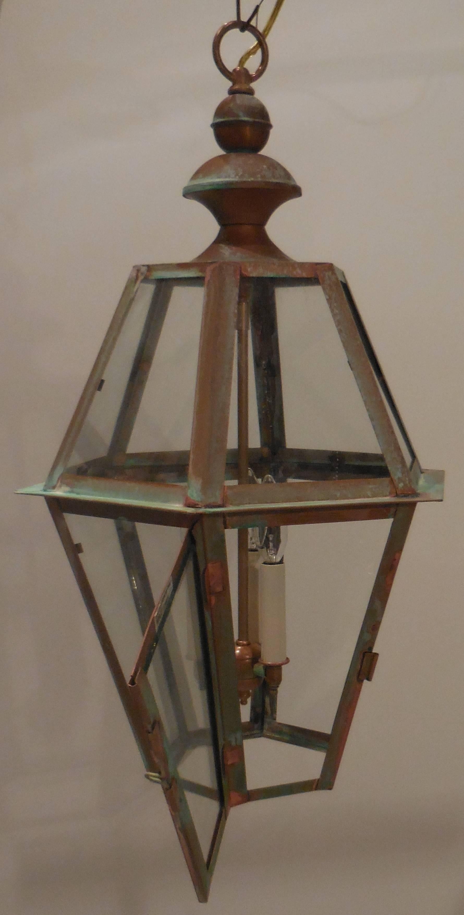 Beautiful geometric lantern made of copper with three light brass stems. 
Each light is 60/watts. 

Electrified up to code and UL approved. 

Great patina.