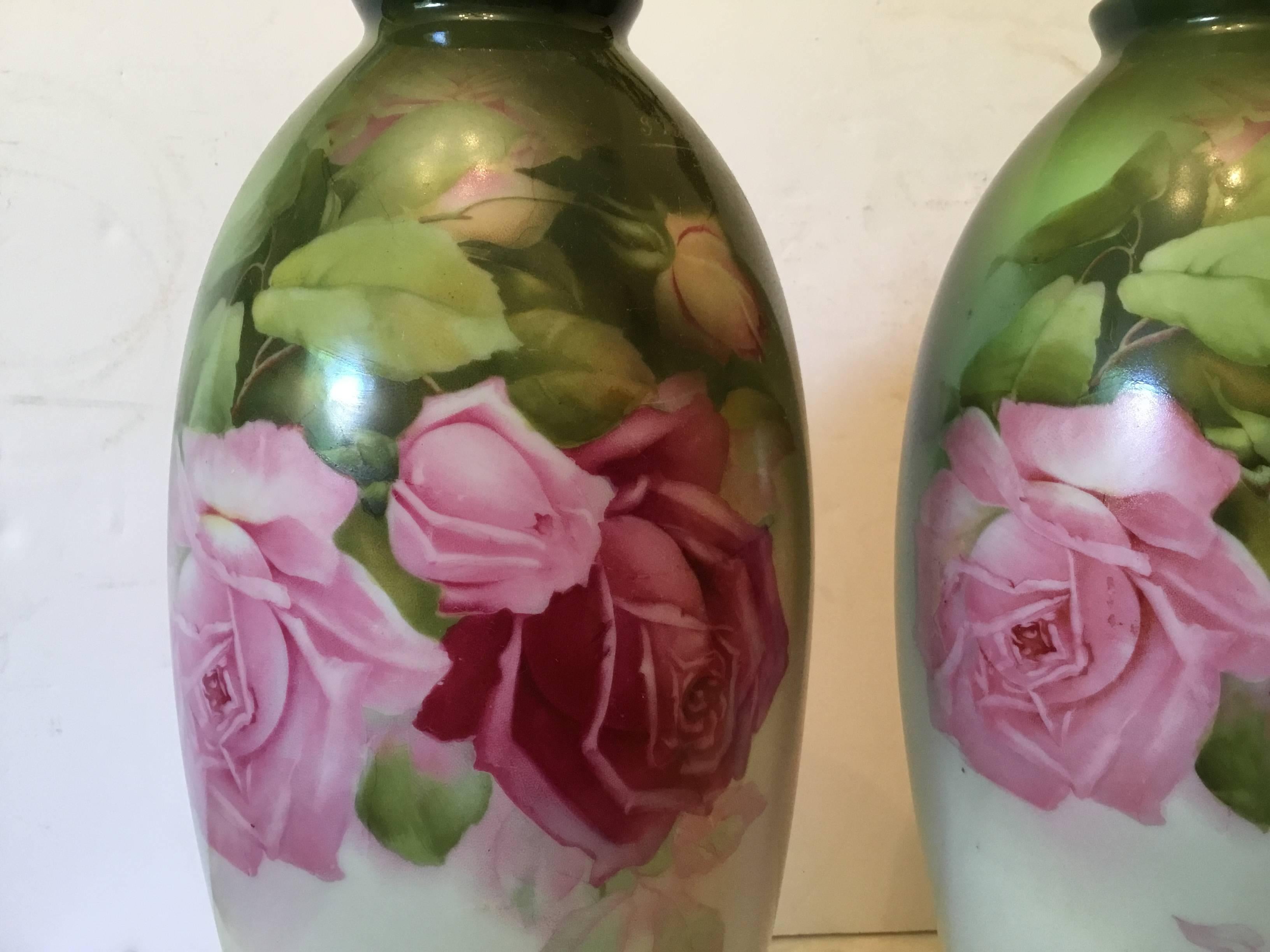 Beautiful pair of porcelain vases, all hand-painted of floral pattern on the front and the back, gold painted ream.
Signed by the artist on the top of each vase.
Signed Bavaria Memtones on the bottom.