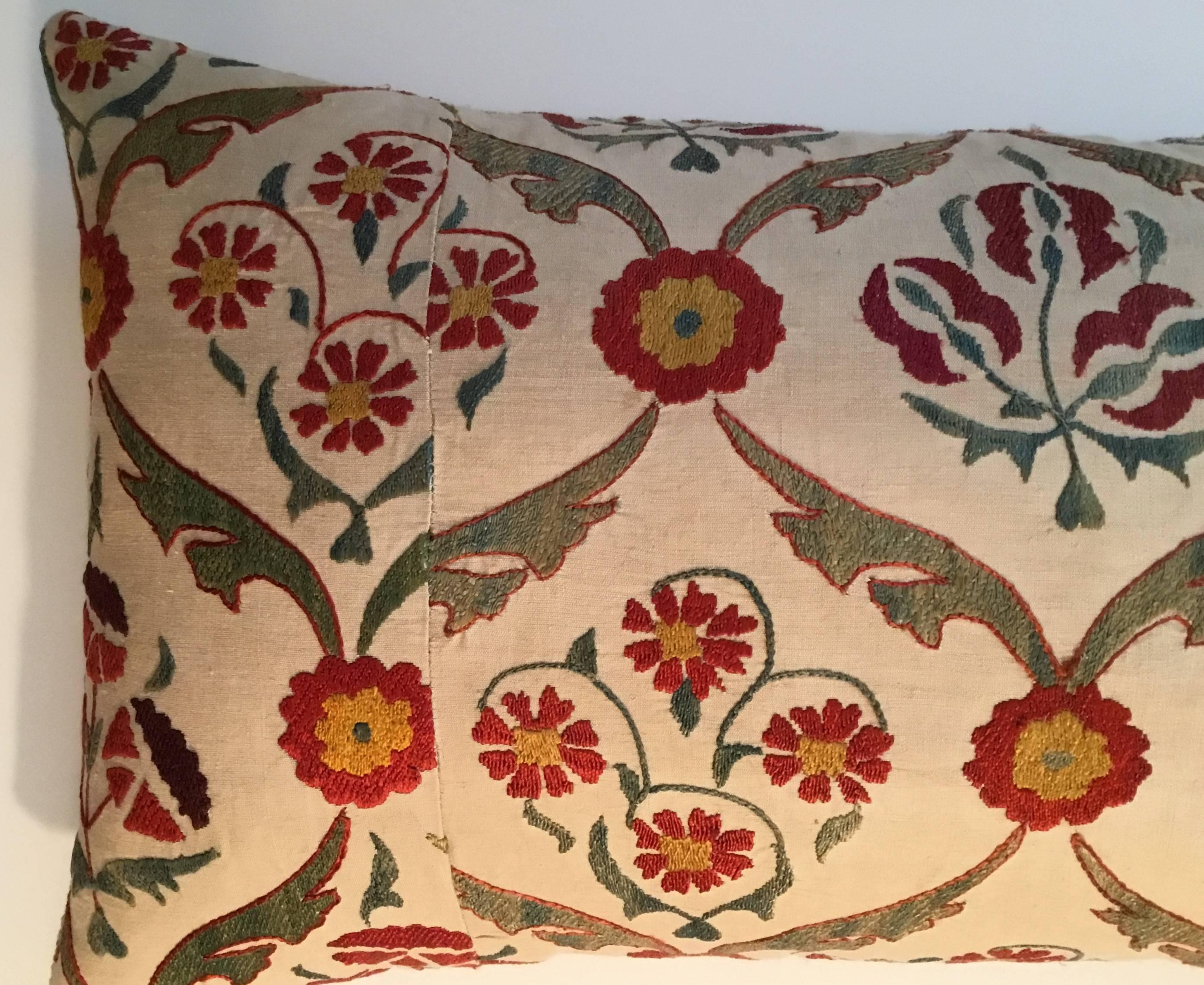 Beautiful pillow made silk hand embroidery Suzani fragment, very intricate motifs of vine and flowers on a cream background.
Frash down and feather insert, fine antique linen backing.
   
