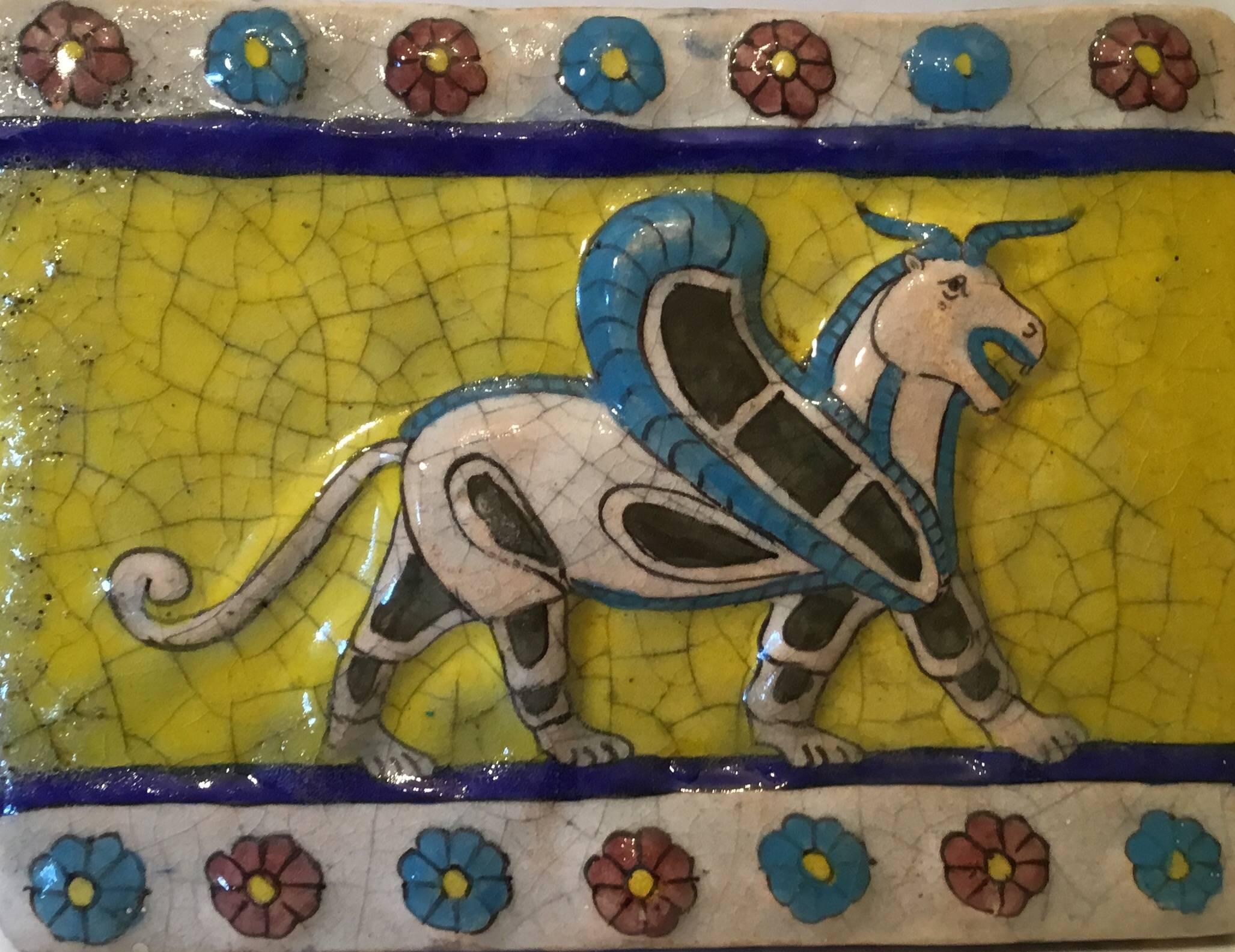 Beautiful Persian tile made of ceramic with colorful Persian mythological animal could hang on the wall too.