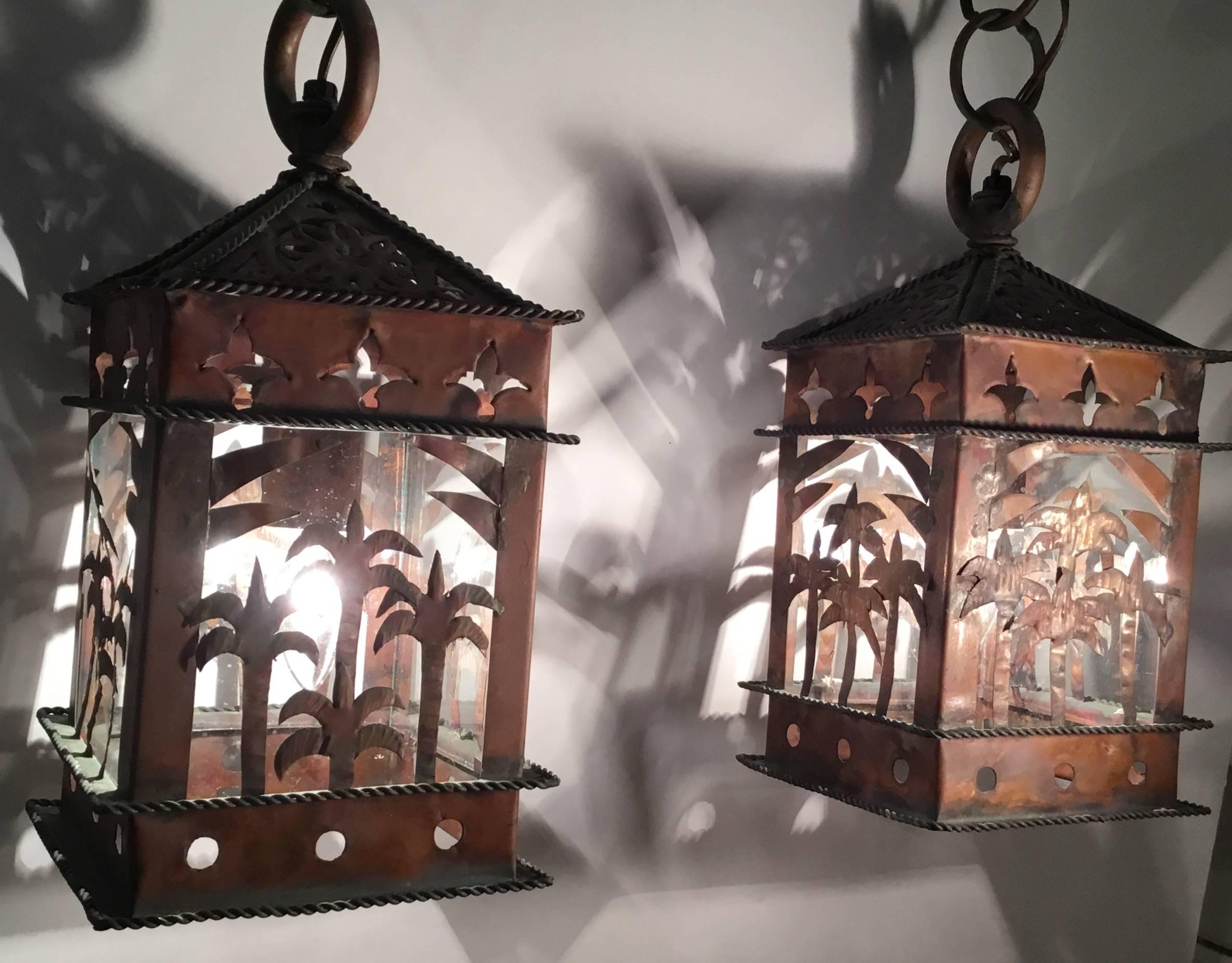 Pair of lanterns artistically made of copper , four glass plates inside.
One 60watt light with porcelain socket.