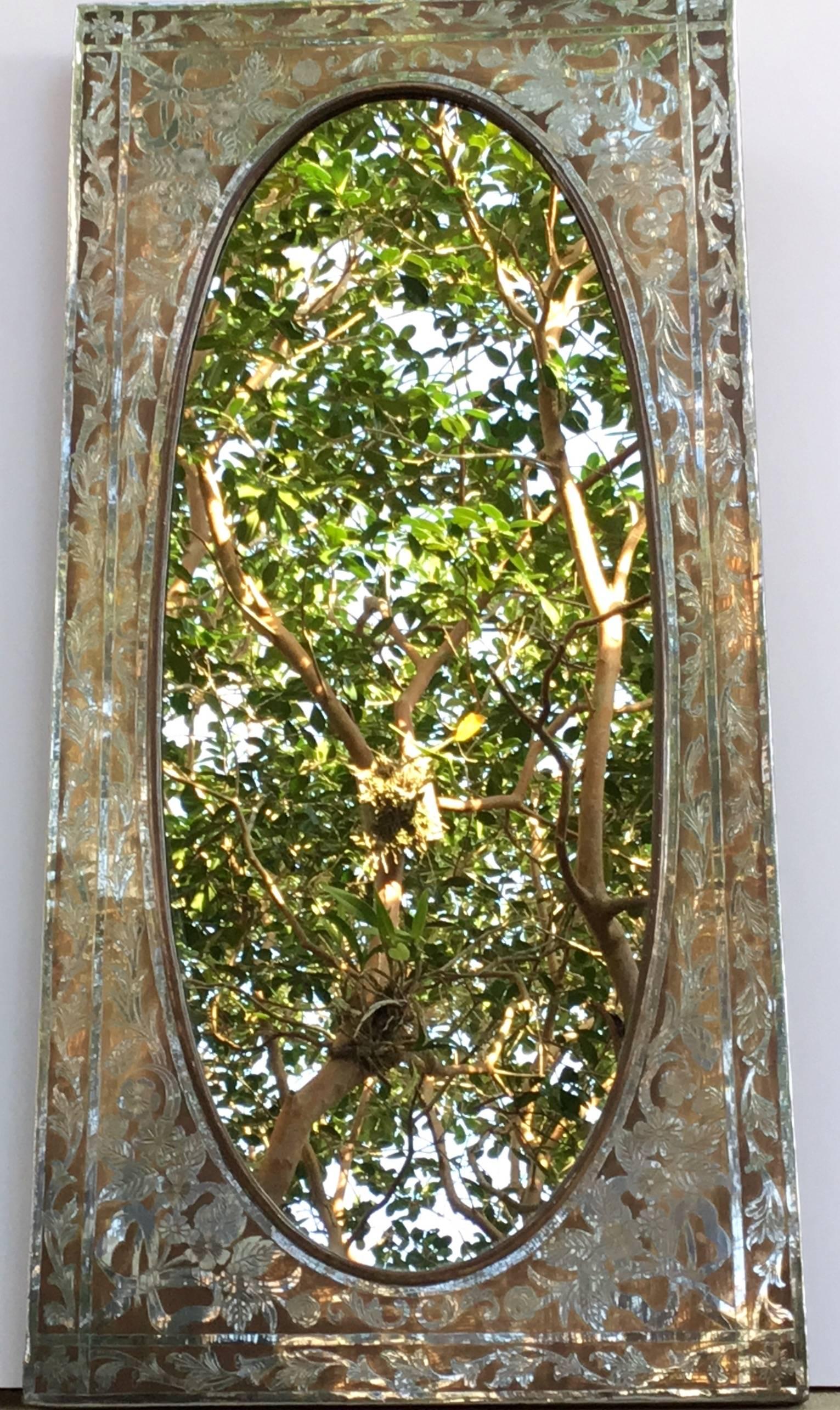 Elegant mirror made of copper, artistically etched with floral and vine motifs
All around.
Wood backing.