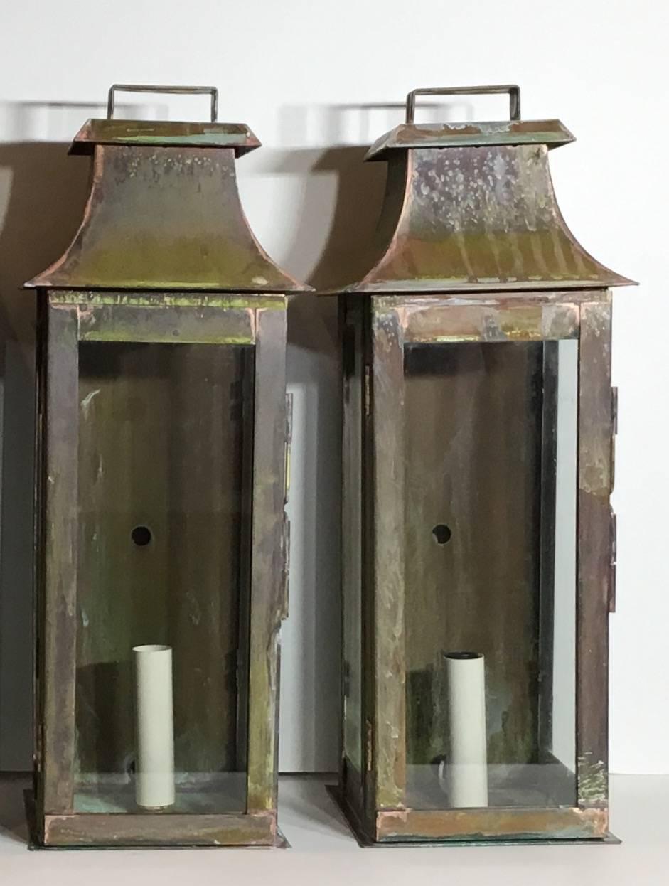 Set of four architectural wall lanterns made of copper and beautifully weathered. One 60/watt light in each.
Suitable for wet location .up to US code, UL approved.
 Will sale pair if requested.
 