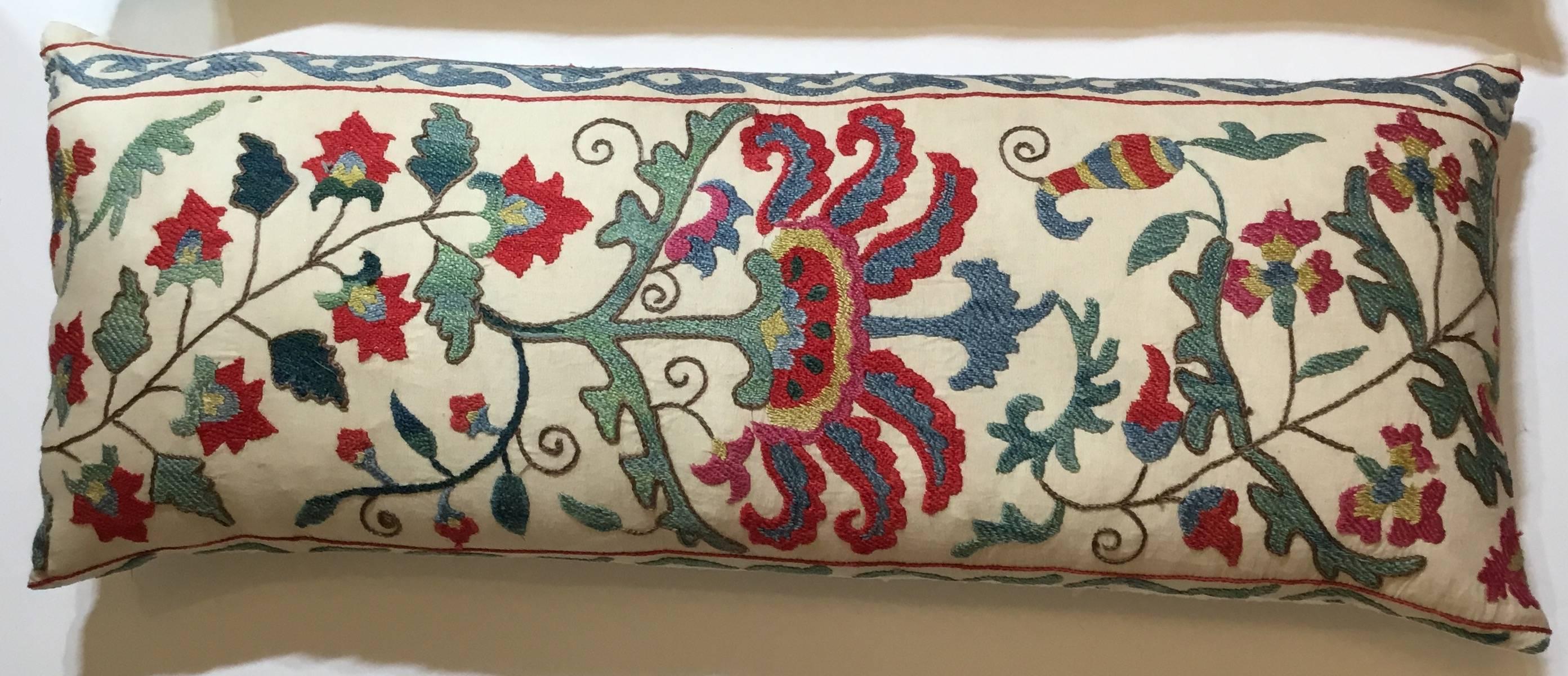 On one of a kind pair of pillows, made of hand embroidery silk on cotton background with beautiful colorful flowers and vine motifs.
Silk backing, down and feather inserts.