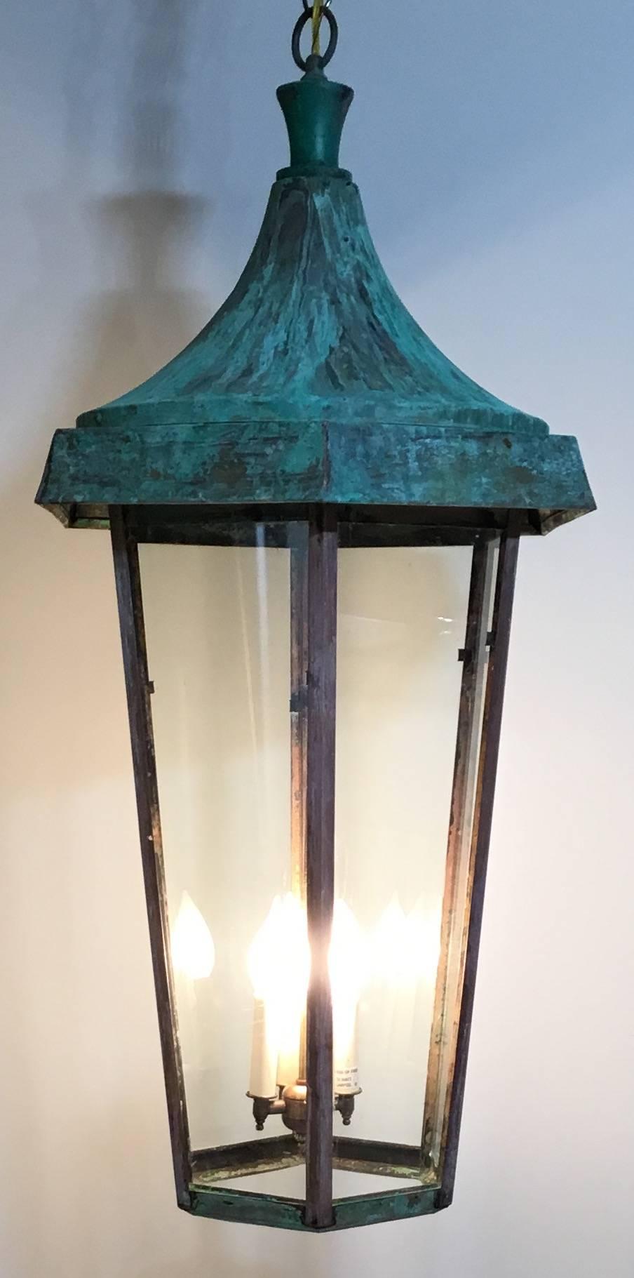 Elegant large vintage hanging lantern made of copper and brass. Beautifully
weathered patina. Six sides with dome shape top. Electrified with four 60/watt
Light and ready to light.
Beautiful copper canopy included.
One more available.