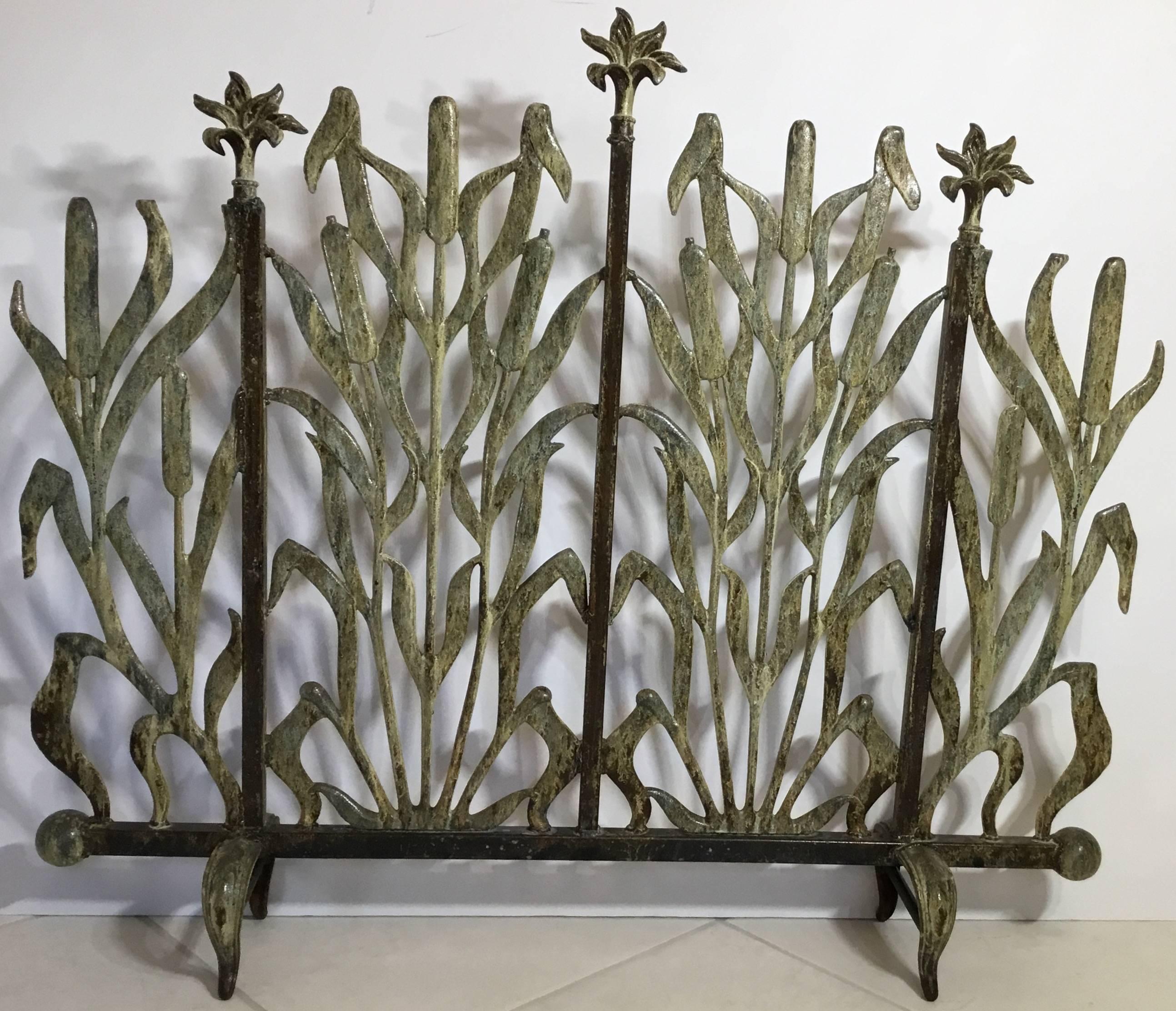 Beautiful fireplace screen made of cast iron, with decoration motifs of cat tail and flowers.
Treated for rust, great patina.