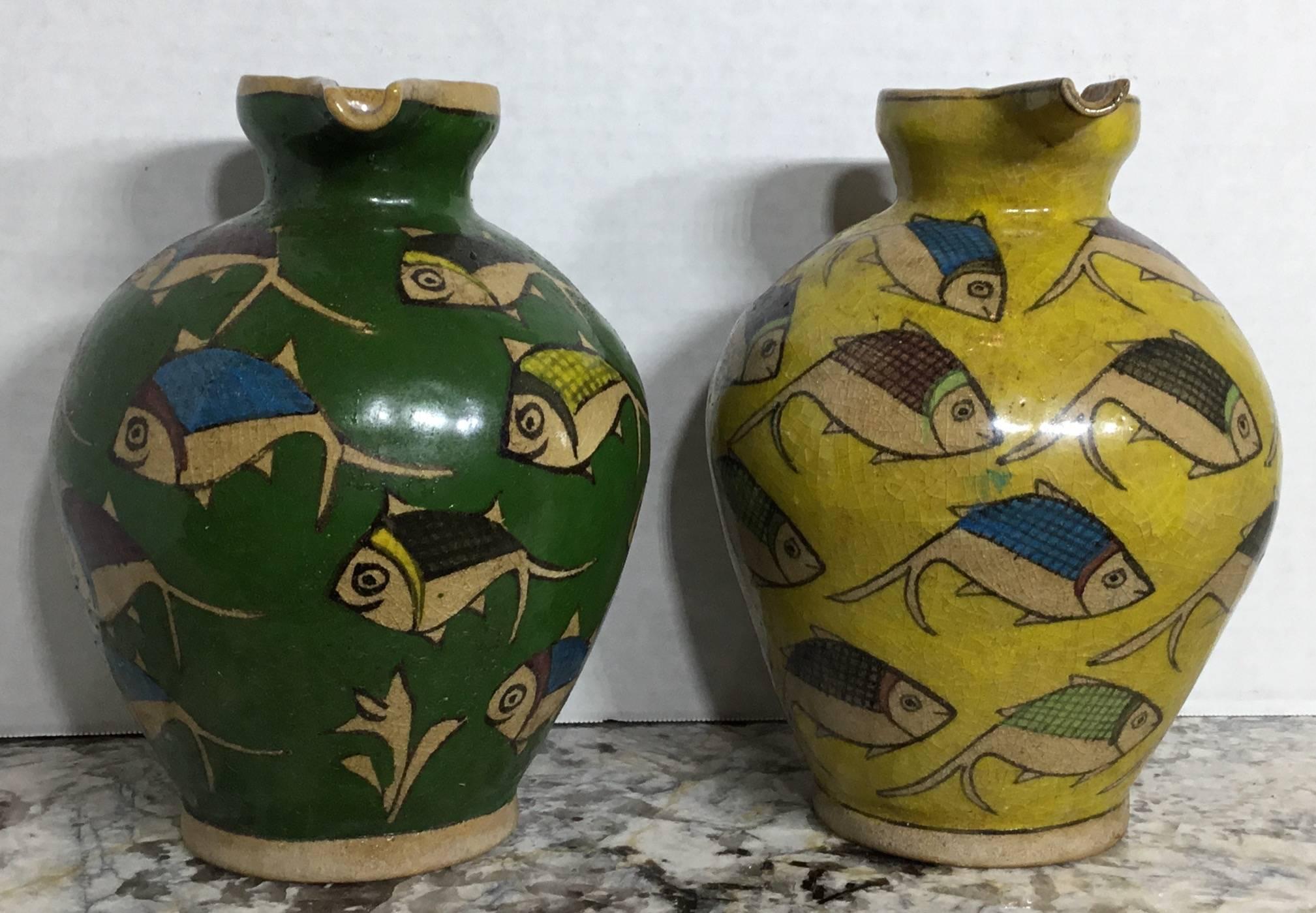 Beautiful pair of Persian vessel, made of ceramic and hand-painted and glazed of fish motif. Great decorative items or can be used as flowers vase.