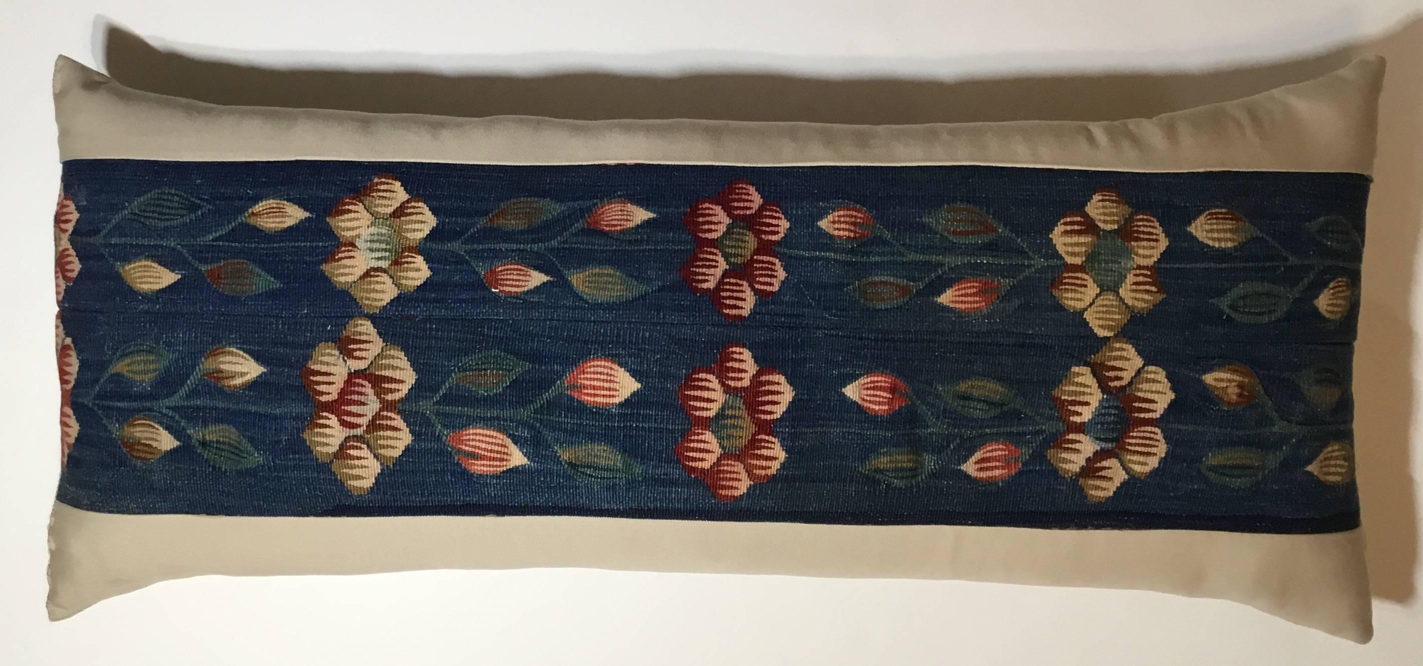 Beautiful pillow made of hand woven flat-weave Kilim rug probably from Europe. Artfully hand embroidery of flowers and grain on a indigo-blue hand woven background. Quality insert ,linen backing.