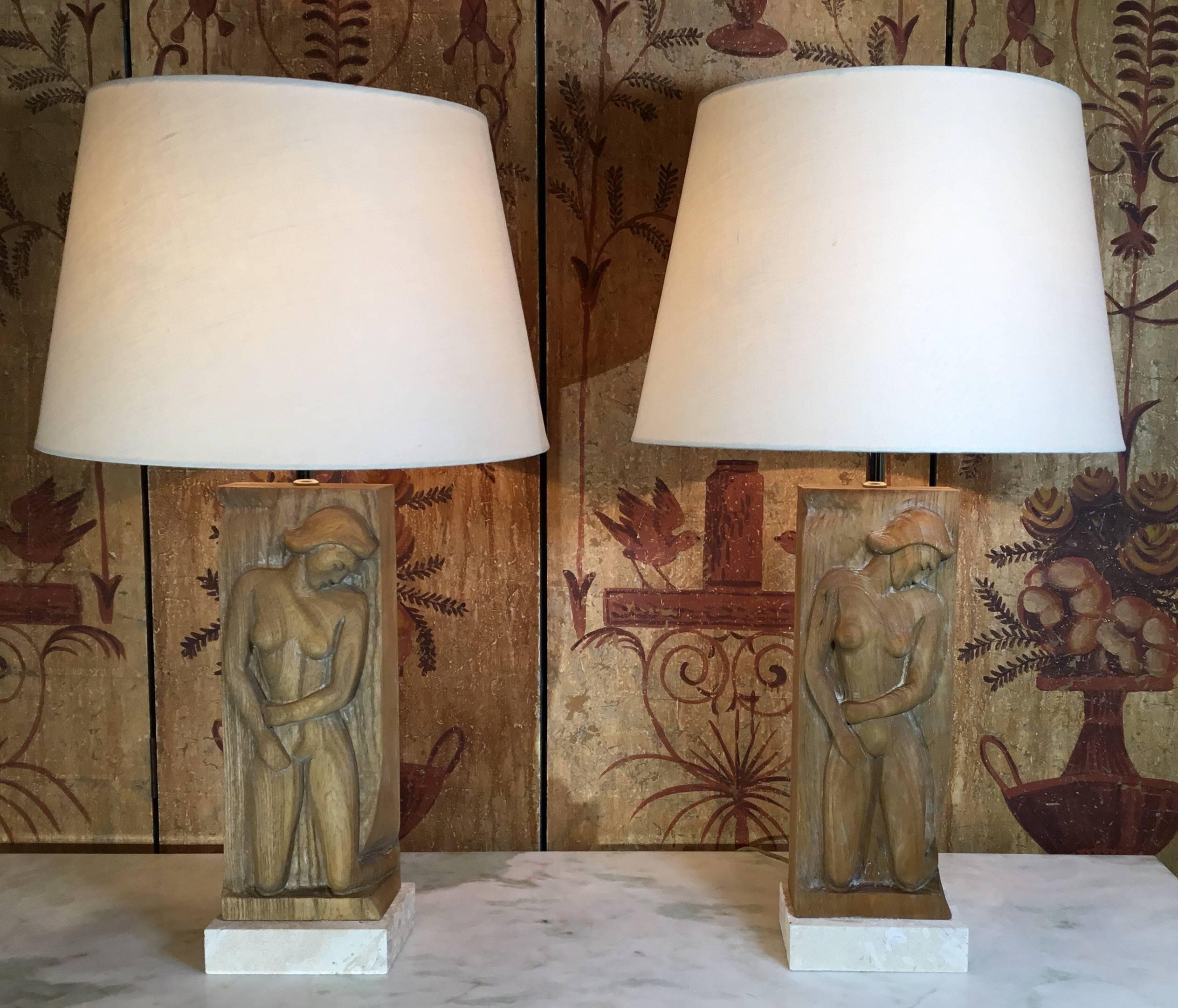 Elegant pair of lamps with hand carve wood of a pretty women, professionally mounted on a
Genuine Natural coral base. Electrified and ready to light. Shades are not included.
Size without the shades from the bottom of the base to the top of the