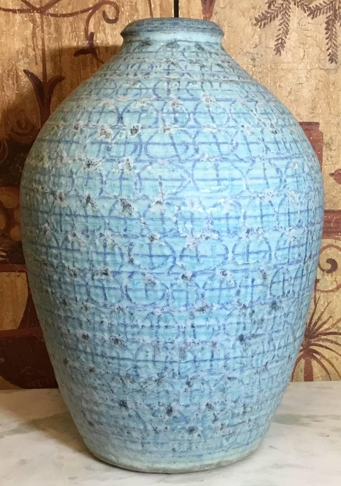 Beautiful one of a kind vase made of heavy glazed stoneware with cubist motifs of circles and squares melting together with exquisite turquoise colors. Some imperfection in the glazing in one spot, artist impression signature in the bottom.