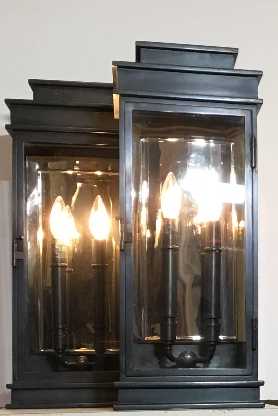 Pair of extra ordinary architectural lantern, fine quality custom-made from brass two 60/watts light
With laminate plat inside to enhance the light, easy to open door.
Suitable for wet locations, up to US code and UL approved.
Great quality pair