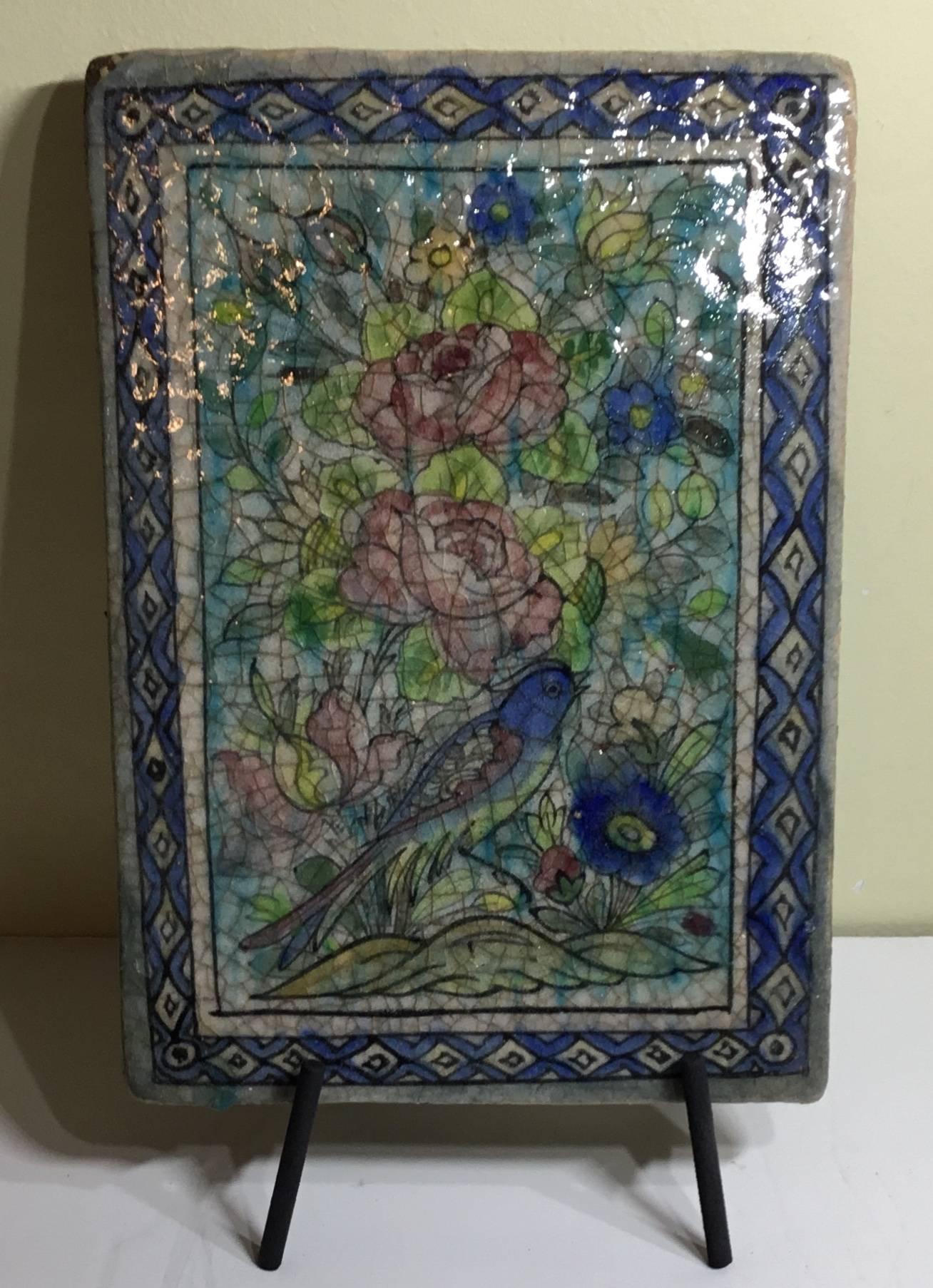 Beautiful Persian tile made of hand-painted and glazed ceramic, with bird surround flowers and vines .great decorative tile display.
Functional display piece included.
