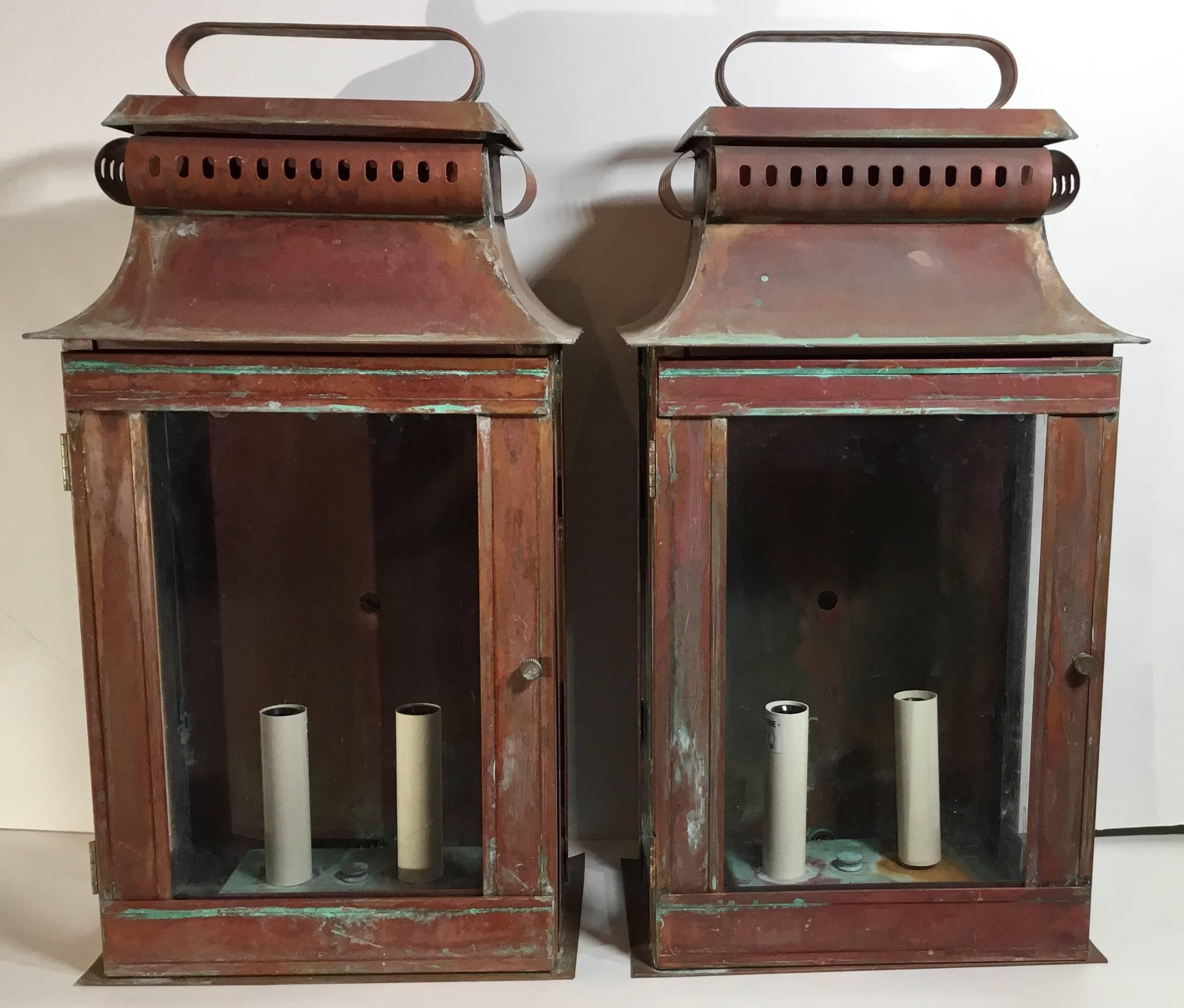 Pair of Architectural wall lantern made of copper, with two 60/watt light each electrified and ready to use. Suitable for wet locations, UL approved up to US code.