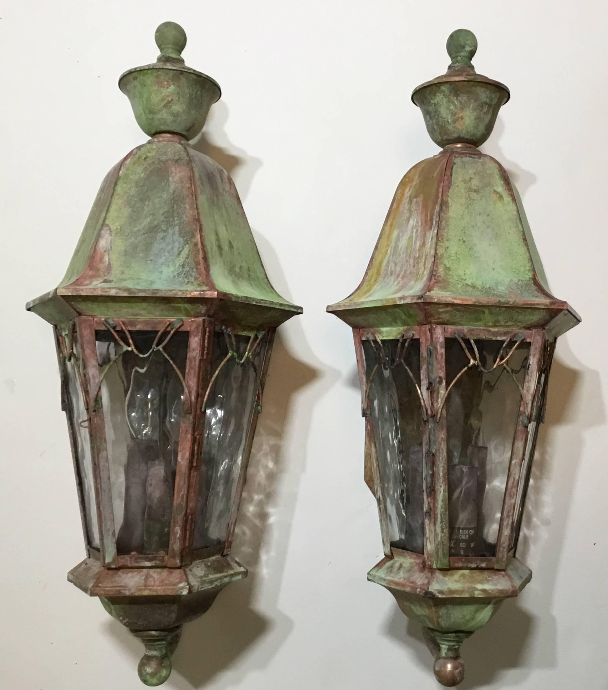 Pair of elagent wall lantern made of brass with three 60/watt light in each lantern , decorative glass ,and beautiful weathered patina. the lanterns are UL approved and suitable for wet location.
Although will look great indoor too.