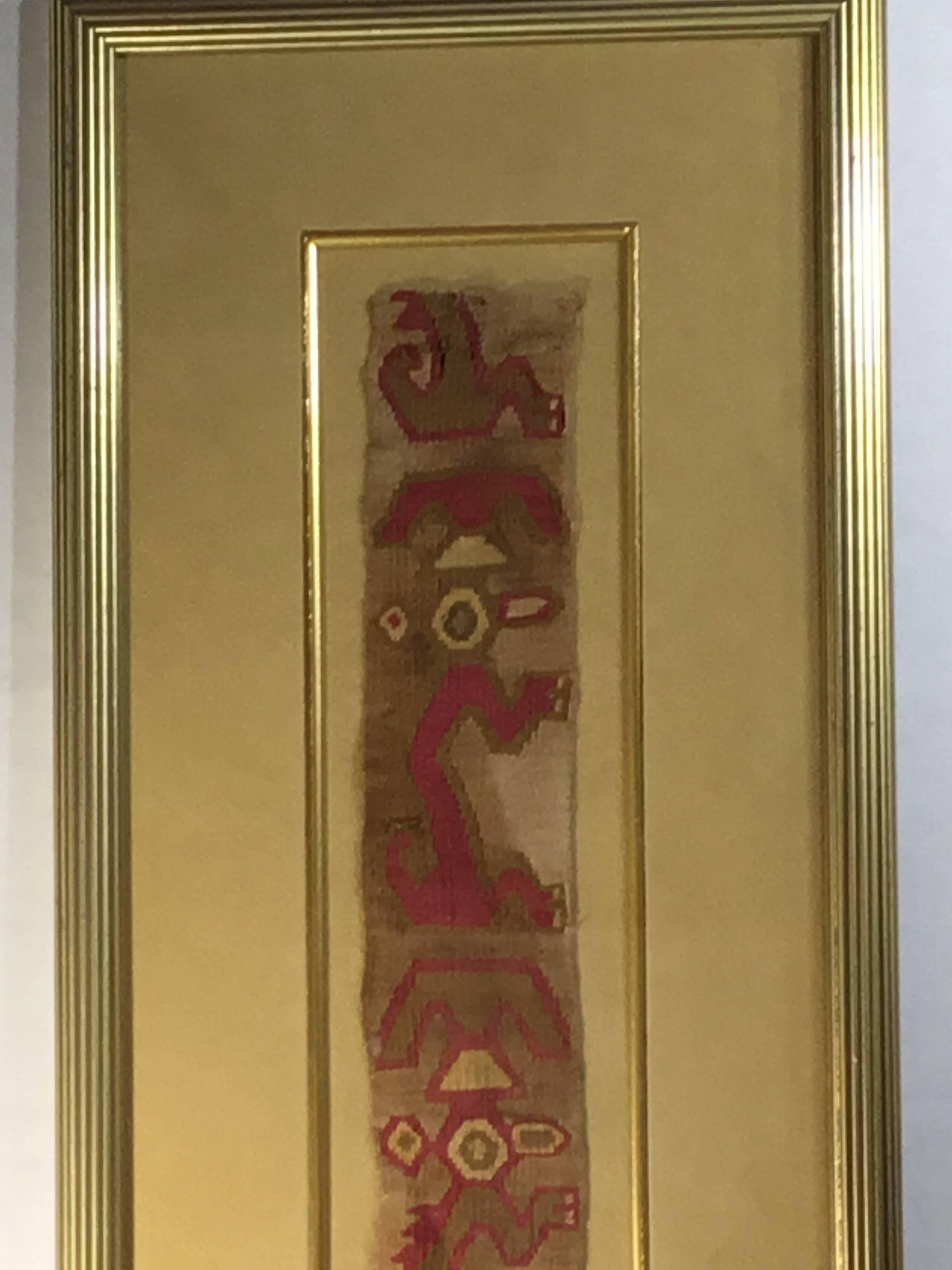 Museums quality hand woven pre Colombian textile bend fragment from Peru, featuring worrier or Martian motif professionally mounted on acid free Matt in very decorative museum quality shadowbox.
The textile dated from late horizon -early colonial