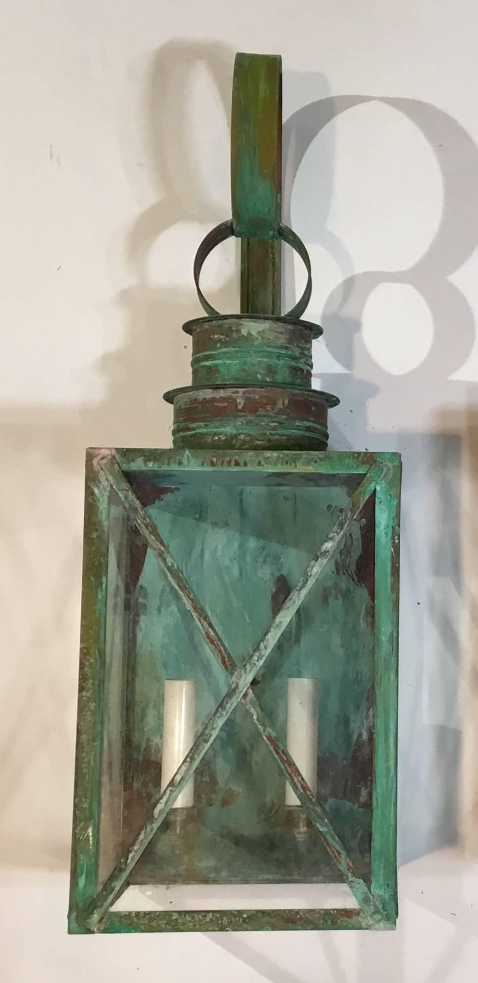 Elagent pair of wall hanging lantern made of copper with beautiful patina, electrified with two 60/watt lights each, UL approved up to US code, suitable for wet locations, great for house entry,
Or even beautiful indoor.
   