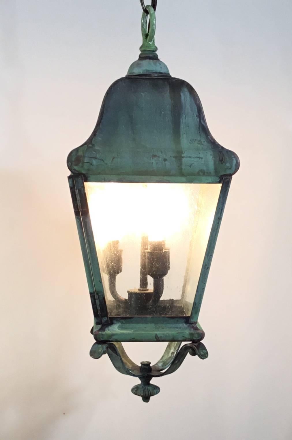 Elagent Hanging ceiling lantern made of handcrafted solid brass, very nice oxidized patina electrified with three 40/watt lights up to US code great for wet locations or decorative indoor.
Brass canopy included.
 