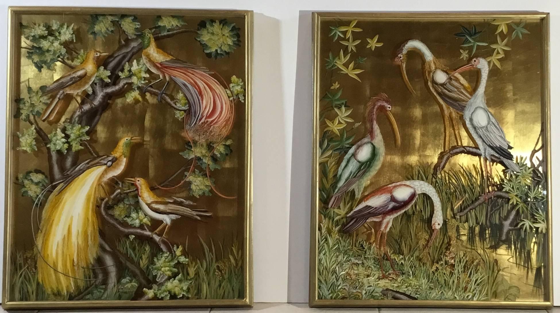 Pair of exquisite vintage reverse paintings on glass made by a special technique with two plates of glass .the back plate is gold gilt glass and is painted with cattail ,grass and vines. the front glass is beautifully reverse painted with birds