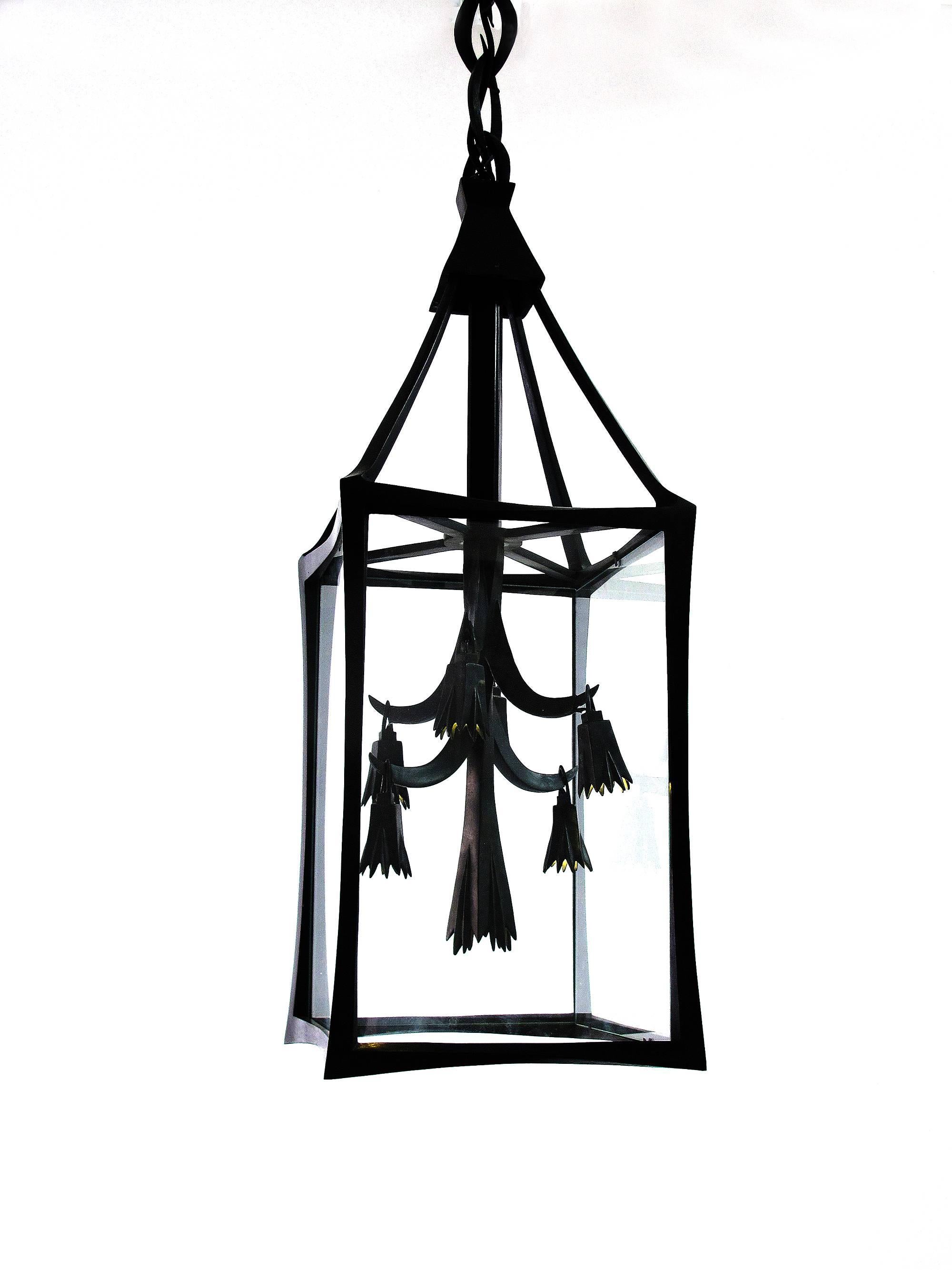 A Classic and elegant lantern in bronze with seven lights. Electrified with LED this sober piece is a masterpiece of craftsmanship

 with the chain as shown the lantern is 54 inches high custom size and finish available.