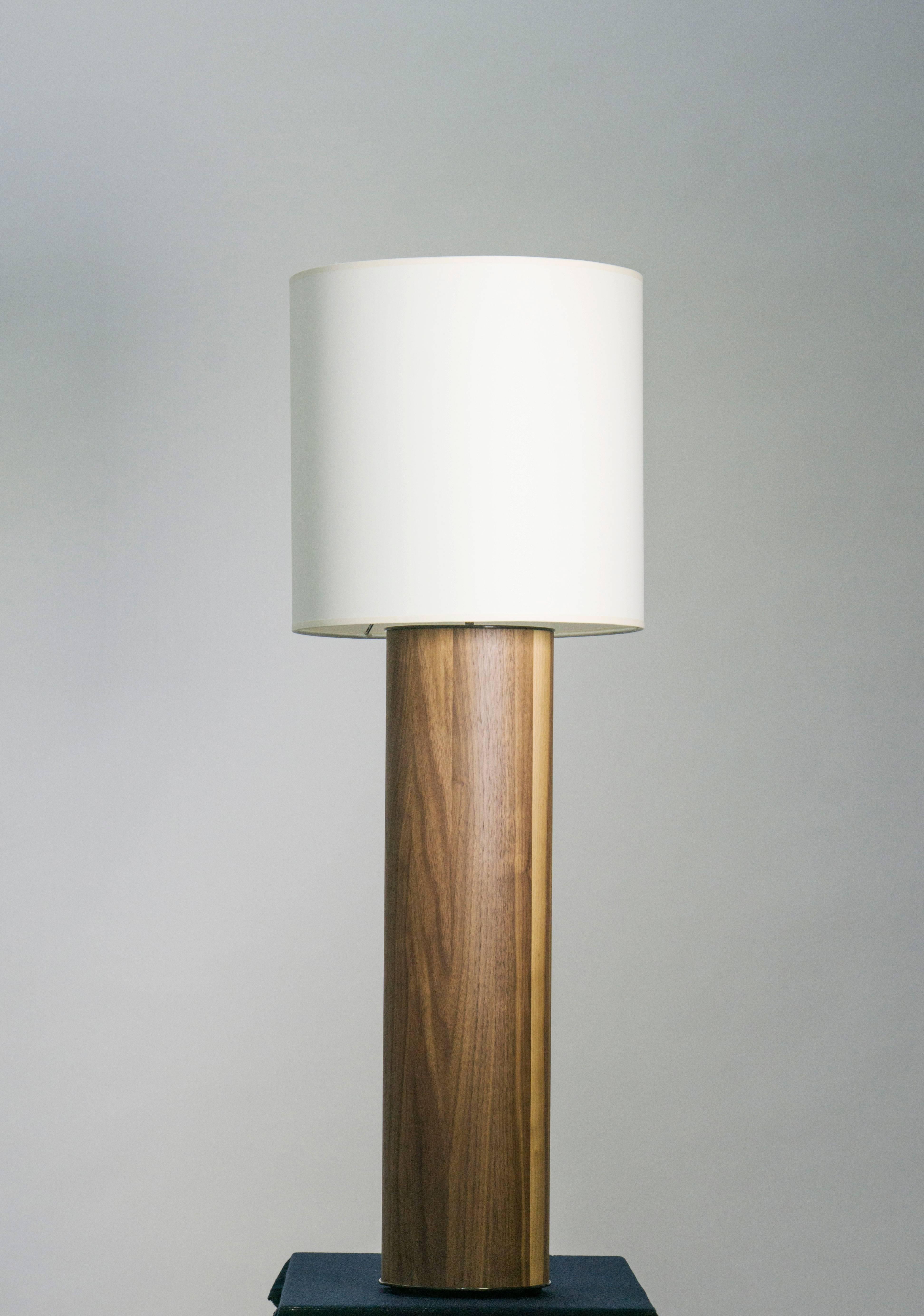 Table Lamp in Walnut by TInatin Kilaberize.

The geometric form emblematic of Tinatin Kilaberidze's work makes the lamp timeless, elegant. The American walnut is the designer's favourite wood for its beauty and warmth.

Dimensions of base: H