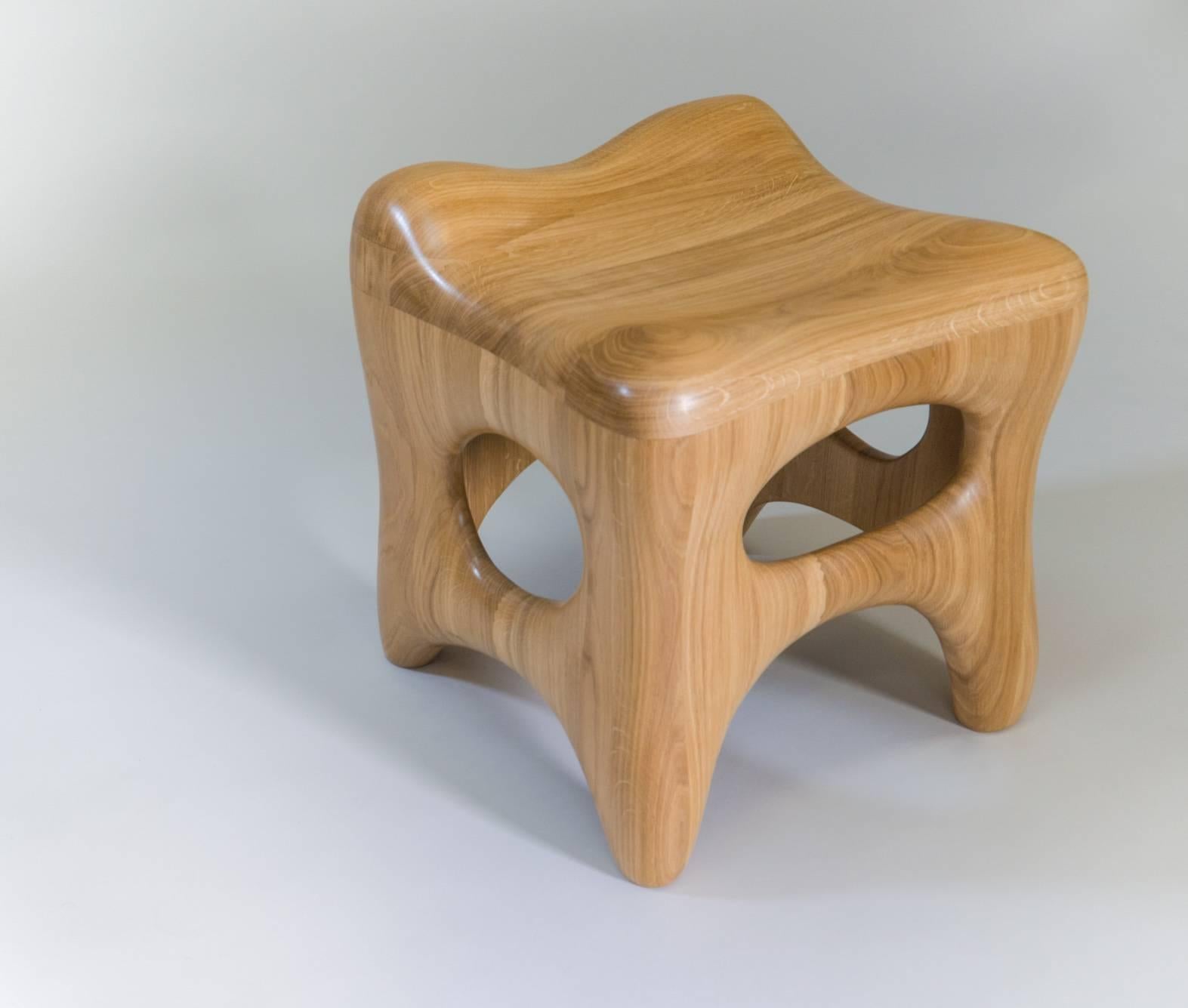 Both sculpture and stool this piece by Jacques Jarrige is evocative and comfortable. Sculpted by hand in solid oak in the artist's Parisian studio the stool explores solid and voids and its interaction with the surrounding space.
