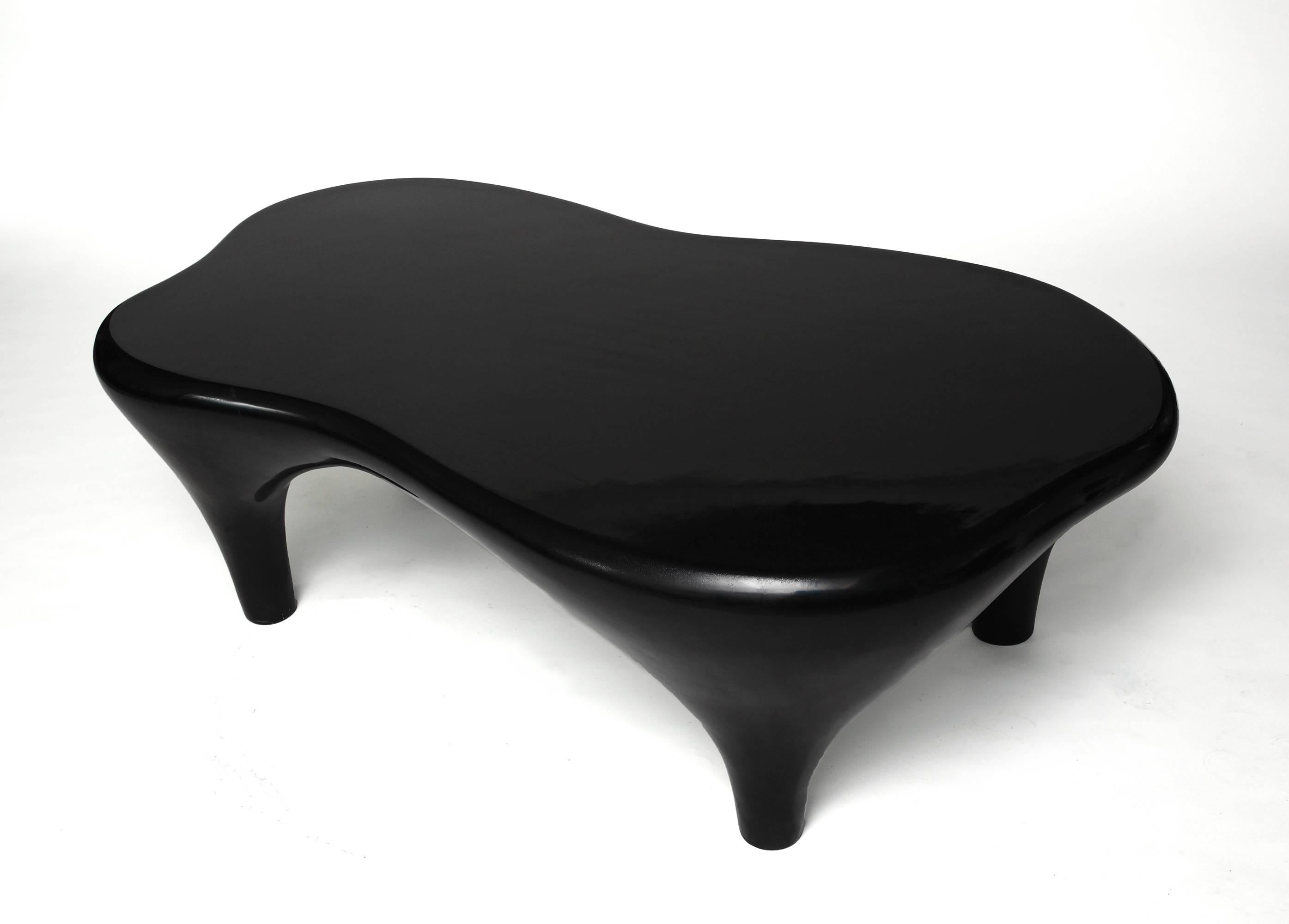 Sculpture or coffee table by Jacques Jarrige finished in hand lacquer.
Jacques Jarrige is a sculptor living and working in Paris. His Toro coffee table with its curvaceous undulating rounded edges and swelling legs feel in perpetual