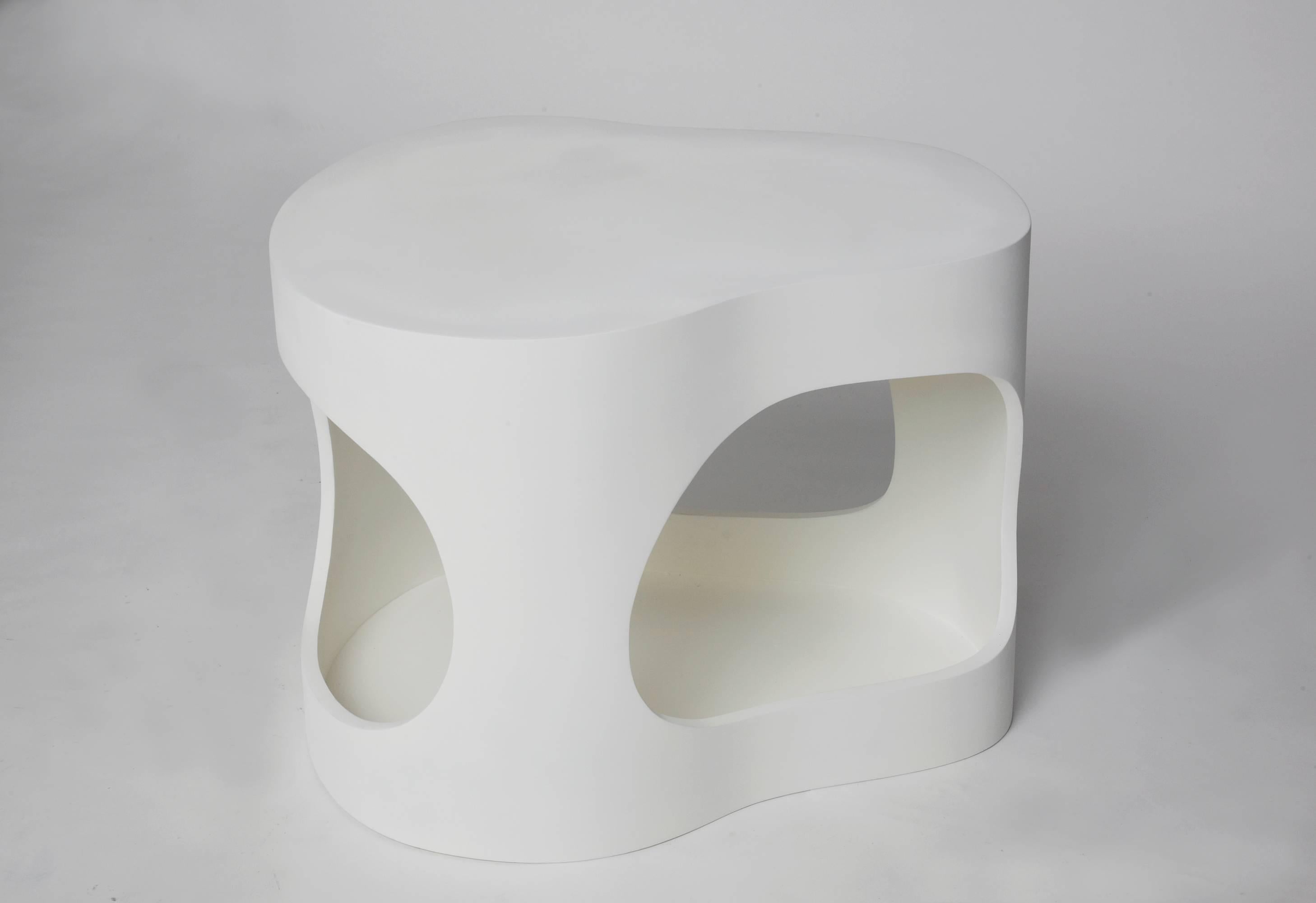 A pair of sculpted side tables shown here white on white but they can be commissioned in custom colors both for the inside and the outside. Jacques Jarrige is a contemporary artist living in Paris. With the juxtaposition of positive and negative