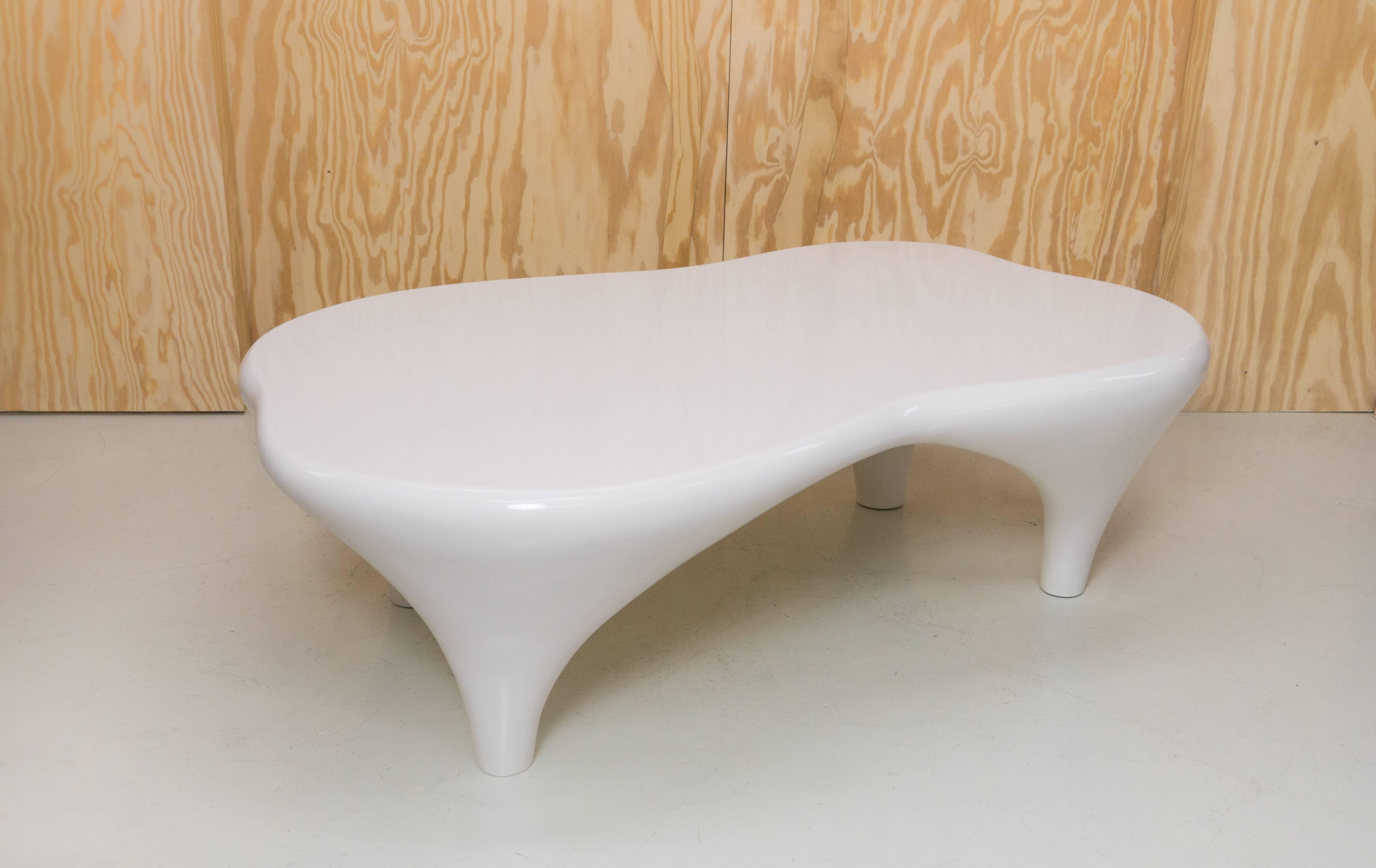 Sculpture/coffee table by Jacques Jarrige finished in hand lacquer. Jacques Jarrige is a sculptor living and working in Paris. His Toro coffee table with its curvaceous undulating rounded edges and swelling legs feels in perpetual movement. This