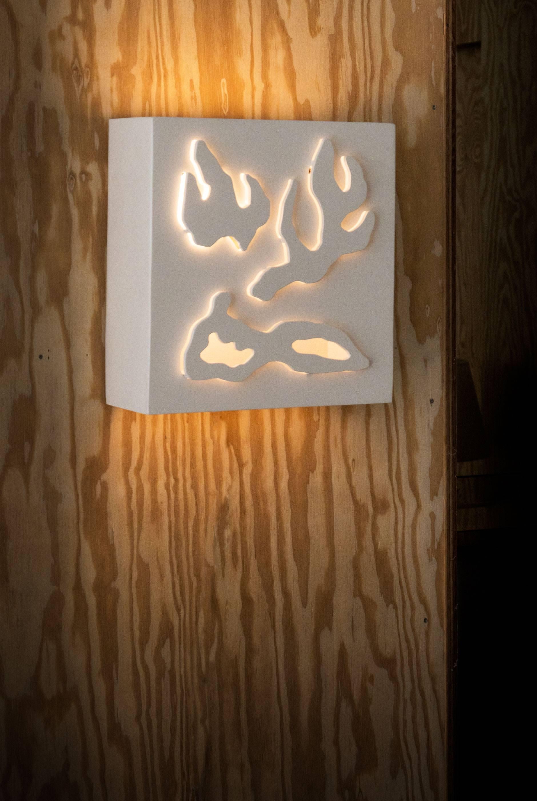 Hand cut lacquered wood sconce, wall light sculpture or table light by Jacques Jarrige. Each one is hand cut by the artist.

This lamp can be used as a wall light or a table light

Outfitted with one bulb but can be adjusted as desired.