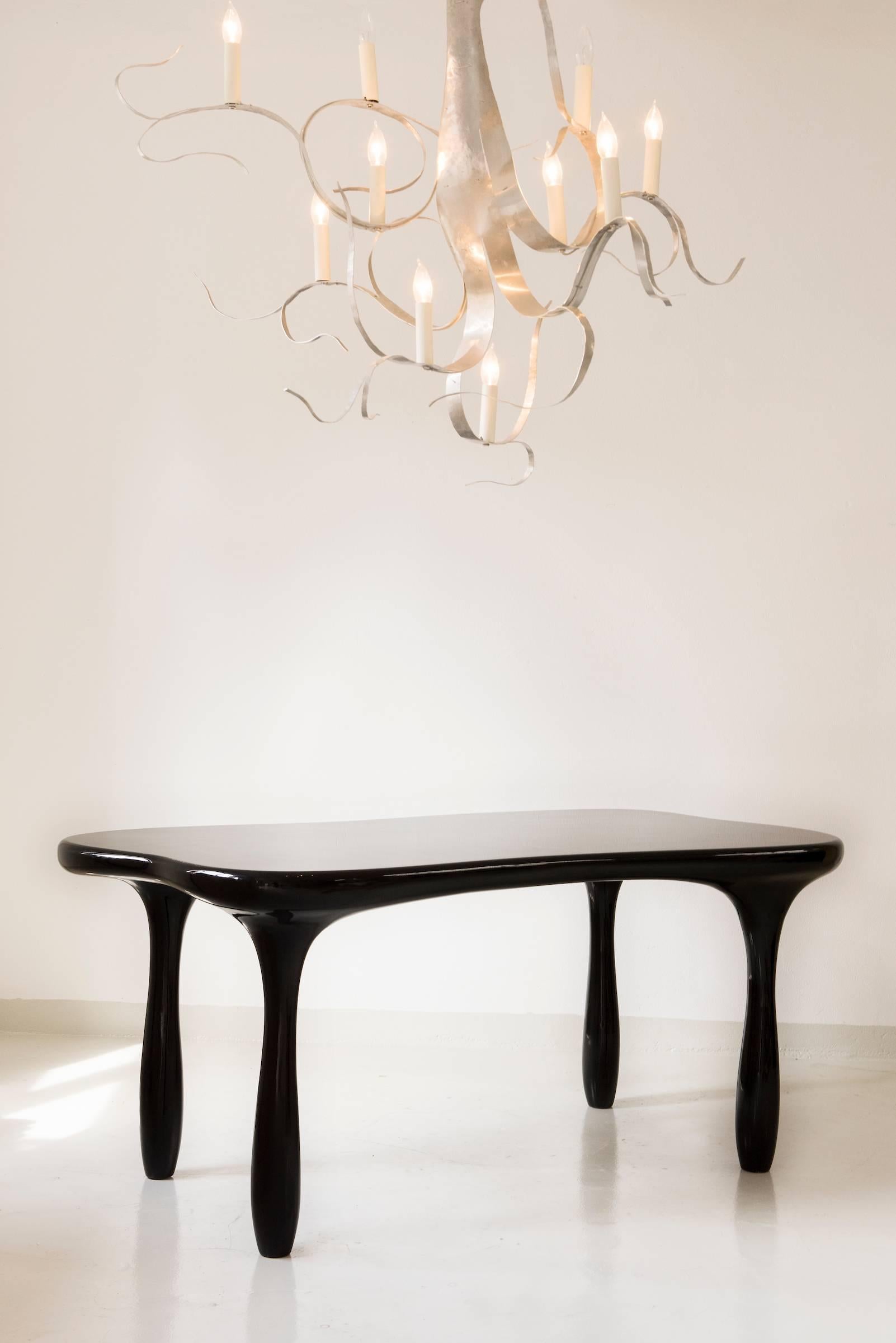 Elegant, sculpted desk or dining table by Jacques Jarrige.