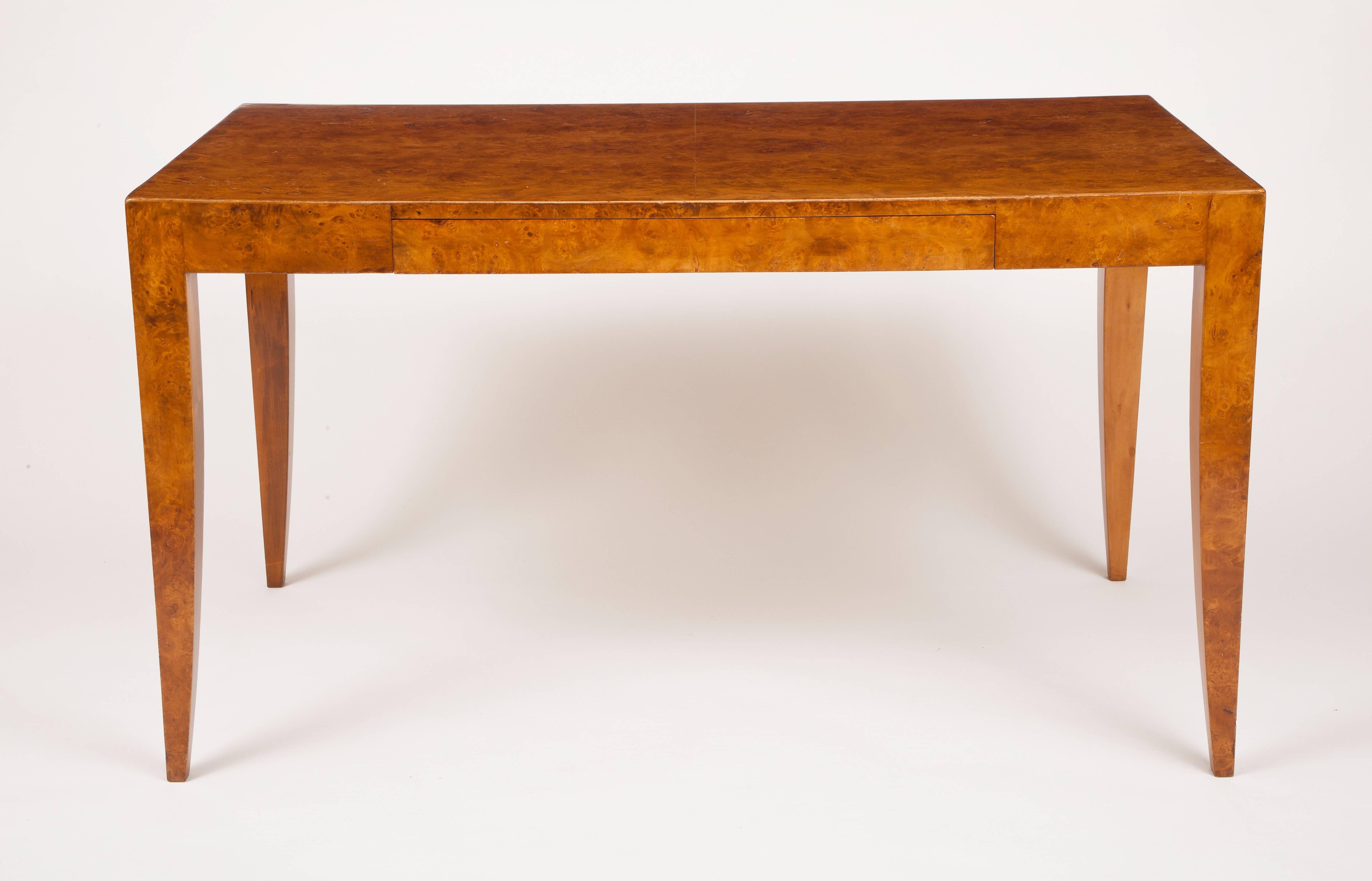 This Italian modern writing table has one drawer and is veneered in burl olivewood.